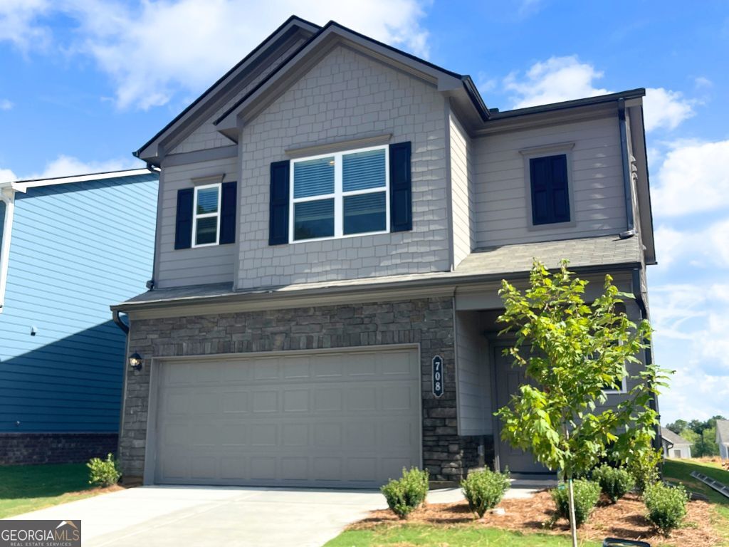Now Leasing - Brand New Home! This never-lived-in Braselton II by Smith Douglas Homes built in July 2025 is located in the desirable Highland Crossing community of Cartersville, with easy access to I-75. Community amenities include a dog park, a children's playground, and HOA-maintained lawns. Residents enjoy close proximity to downtown Cartersville, the Smithsonian-affiliated Tellus Science Museum, the Booth Western Art Museum, and the Savoy Automobile Museum. Outdoor enthusiasts will appreciate nearby Red Top Mountain State Park and Lake Allatoona. Convenient shopping and dining options-including Walmart, CVS, Panera, and Starbucks-are nearby. This two-story home all electric home features 9-foot ceilings on both levels, a covered patio, and upgraded luxury vinyl flooring on the main level. The open-concept kitchen features an island, upgraded cabinets and light fixtures. Upstairs, a loft separates the Owner's suite-which includes a large walk-in closet and a dual-vanity bath with a shower-from two additional bedrooms. The laundry room is conveniently located upstairs near all bedrooms. Be the first to live in this beautifully designed, brand new home-schedule your tour today! Some of the photos are of the builder's decorated model home and are for illustrative purposes only. Actual home vary in design, features, and finishes.