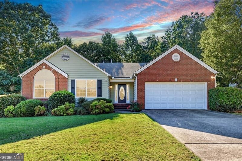 First time on the market! Spacious 4BR/2BA ranch with all living on one level plus a full daylight, walk-out basement. Features include tall ceilings, vaulted dining room, beautifully trimmed, with hardwood floors, vaulted front bedroom with Palladian window, and a vaulted sunroom overlooking the private back deck. The oversized master suite offers double vanity, walk-in closet, and updated tiled accessible shower. Home is fully accessible with garage ramp in place. Original finishes throughout give buyers an opportunity to update and add value. Basement provides excellent storage or finish for additional living space. Large .88-acre lot in a quiet neighborhood close to schools, shopping, and dining-convenient to I-985 and I-85.