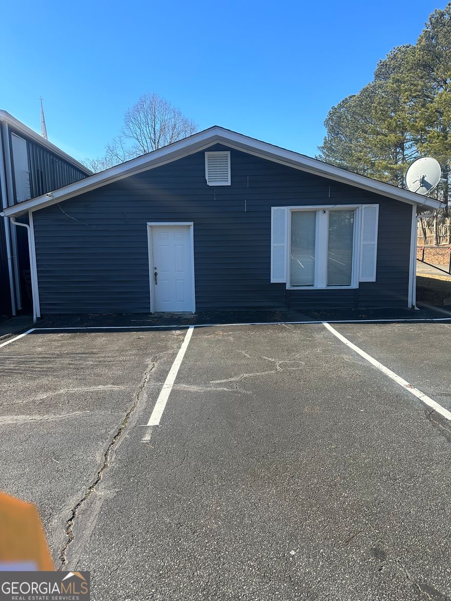 Prime Commercial Lease Opportunity in Marietta, GA. Office is located in a church complex off Holly Springs Road. Close in proximity to Sandy Plains Road, Shallowford, and Roswell Road. This great space offer a fantastic opportunity to established your business in an ever changing area of East Cobb. This building has a kitchen and full bathroom with a stand-up shower, in addition to a small conference room/large office space your choice. A blank slate awaits you to/ customized this building into your design and business concepts. Interior of the building can be built up to your taste or you can easily, update the paintings and minor fixies on the hardwood floors and move in. Owner is willing to offset part of the repairs on a reduced rents, subject to discussions. The only expense you need to worry about is your utilities; the owner takes care of taxes and insurance, simplifying your overhead costs. Contact us today to scheduled a private touring of the facility, and take your business to the next level in Marietta, GA This complex also has a 10,060-square foot brick building was originally constructed to serve as a Youth Chapel and Education Center. It has a lot to offer that too much to disclose here see FMLS# Bring Offer's