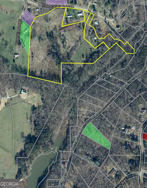 Situated on C Rogers Road in desirable Hall County, Georgia, on Lake Lanier this 19.738-acre property offers a rare blend of privacy, natural beauty, and convenience. The land features access to Lake Lanier, gently rolling terrain with a mix of open space and mature hardwoods, making it an ideal setting for a private estate, mini-farm, or recreational retreat. With road frontage for easy access and utilities nearby, the property is well-positioned for development or long-term investment. Located just minutes from Gainesville, Highway 129, and other major routes, this peaceful tract provides the tranquility of country living with the benefit of nearby amenities. Whether you're looking to build your dream home, create a hobby farm, or hold for future potential, this versatile piece of land offers endless possibilities.