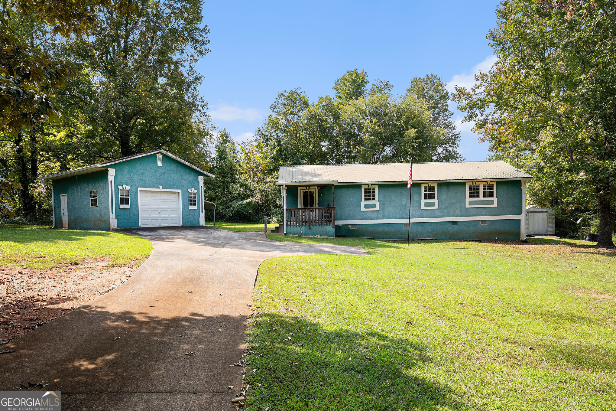 Seller to offer $5,000 towards CC. Selling AS IS!!!! Check out this beautiful home in the great Covington area. This home has a new water heater, new stove, new refrigerator, and fairly new metal roof. This home will also come with an extra lot that can be used to build on. As you enter the home there's an open concept living/dining room. Primary suite has large bedroom with a walk in closet being used for landry room. Primary bathroom granite counters and storage shelves. This home comes with a detached garage and a detached car port. It also comes with a seperate storage sheet for tools and lawn material. Enjoy your coffee/tea on a porch and large backyard with mature trees. Brand new electrical, HVAC, updated plumbing. Brand new insulation in the attic, free of termites, septic tank is in great working condition. Convenient highway access. The location offers easy access to an array of retailers, restaurants, entertainment, and much more.