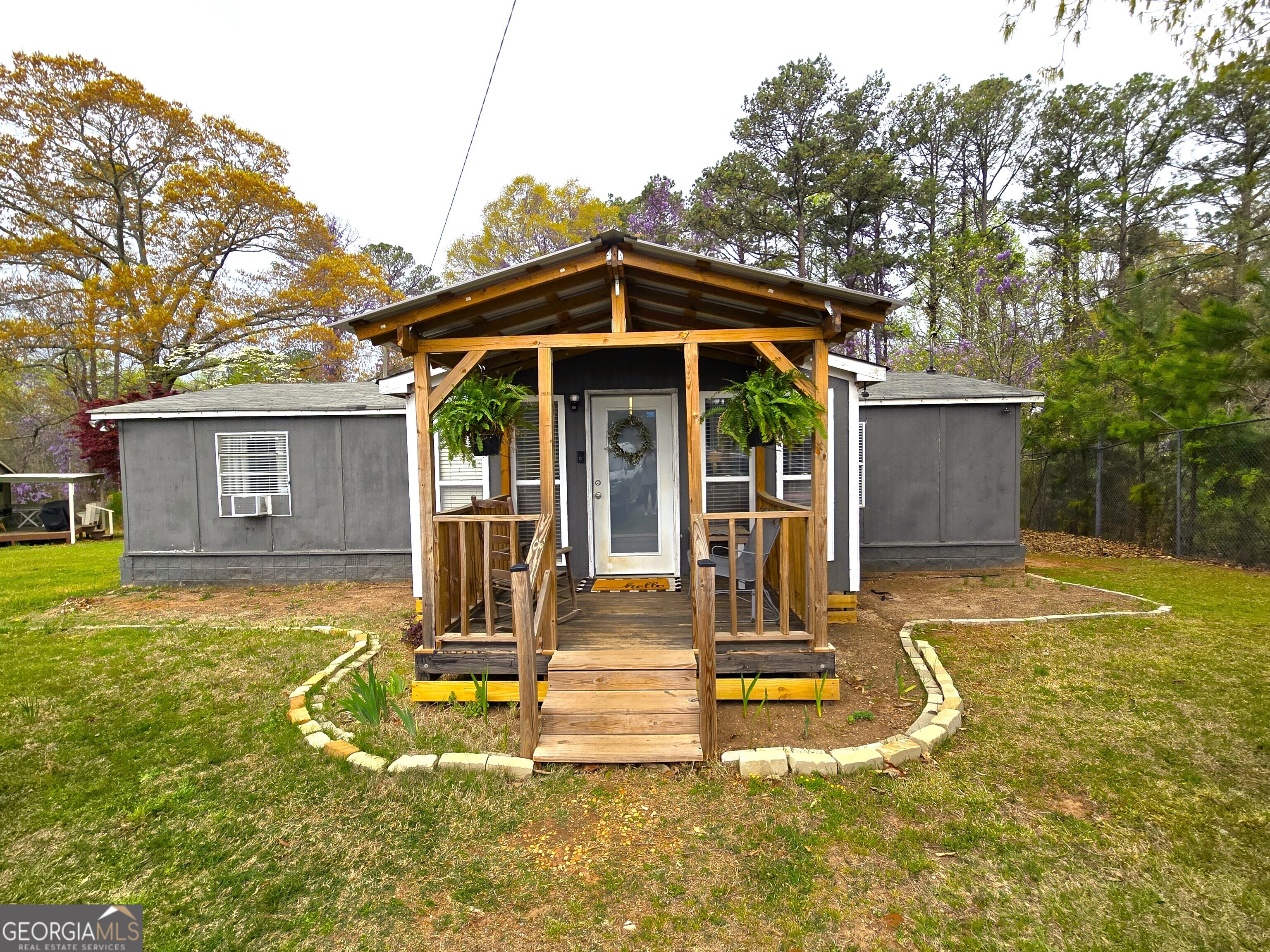 Nestled in a prime location in Dallas, Georgia, this charming 3-bedroom, 2-bathroom mobile home offers both comfort and convenience. Imagine stepping outside your door and within moments finding yourself amidst a variety of restaurants, making dinner out a breeze. Grocery shopping becomes a quick and easy task with multiple options just a minute away. Peace of mind comes standard with medical facilities and schools also conveniently located within the same short distance. Set on a large lot, this property provides ample outdoor space for relaxation, gardening, or play. Inside, the cozy living room features a wonderful wood-burning stove, perfect for creating a warm and inviting atmosphere on cooler evenings. Commuting or exploring is made easy with an approximate 30-minute drive to Acworth, GA, expanding your access to amenities and entertainment. This mobile home presents a fantastic opportunity for comfortable and convenient living in Dallas.
