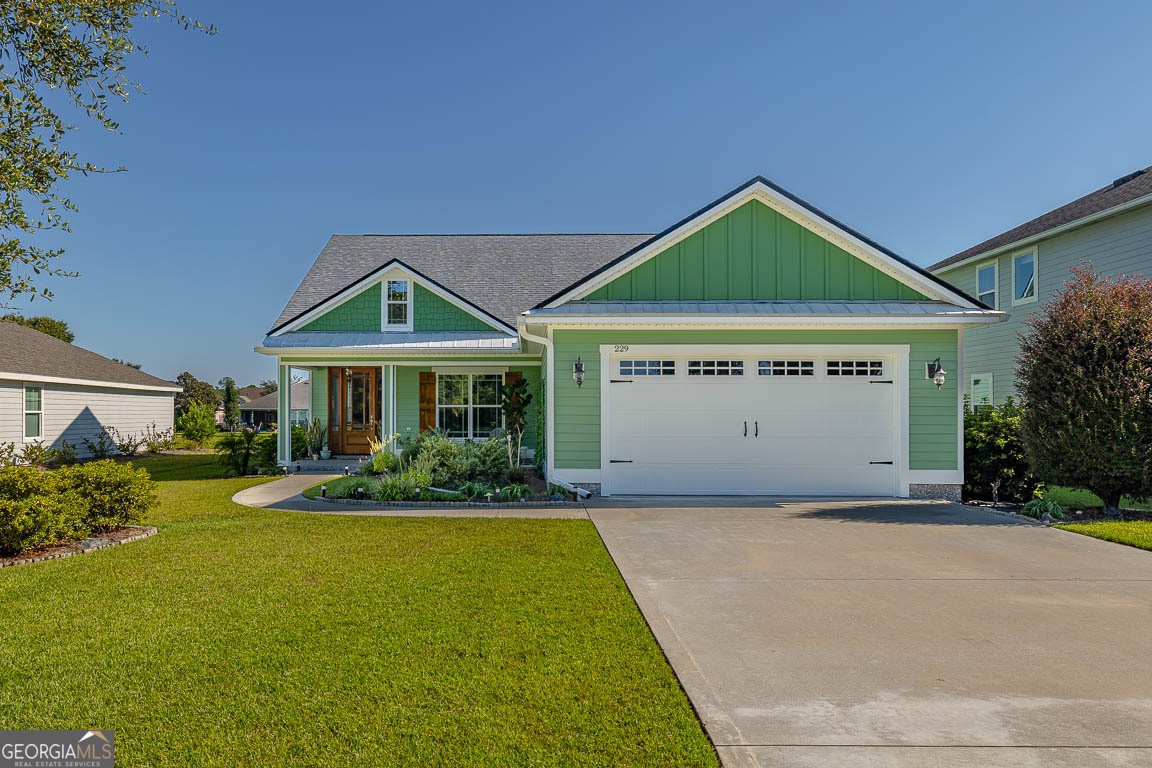 Welcome to 229 Ebb Tide Crossing, a beautifully maintained 3-bedroom, 2-bath Craftsman-style home with 1,848 sq. ft. of thoughtfully designed living space. Built in 2019, this home shines with new exterior paint, a whole-house water softener, gutters, and stunning curb appeal and landscaping. Step inside to find high ceilings, crown molding, tile floors in the main living areas, plush carpet in bedrooms, and a smart layout that combines style with function. The open kitchen offers stainless steel appliances, abundant storage, and modern finishes, flowing seamlessly into the living and dining areas. One of the spacious bedrooms features a built-in desk, perfect for a home office or study space. Relax in the screened porch overlooking the lake or entertain outdoors on the extended concrete patio with room for grilling, dining, and enjoying a large backyard. The serene water view and manicured landscaping make the backyard a true retreat. The very spacious primary suite includes a walk-in closet, dual vanity, garden tub, and separate shower, creating a spa-like space to unwind. As part of this vibrant community, residents enjoy access to a clubhouse, pool, fitness center, playground, park, and lake access-all for just $88/month HOA. Located near Sugarmill Elementary, St. Marys Middle, and Camden County High School, with easy access to Kings Bay Naval Base, Jacksonville, and I-95, this home offers both convenience and lifestyle. 229 Ebb Tide Crossing combines modern comfort, outdoor living, and community amenities-making it the perfect place to call home.