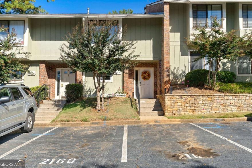 Welcome home to this beautiful 2 bedroom, 2.5 bath condo that perfectly blends modern style with everyday comfort. The open concept main level features a spacious living area with a wet bar connecting the dining space and living room along with sliding glass doors that open to your own private fenced yard, perfect for relaxing or entertaining. The kitchen is a true highlight, showcasing granite countertops, two tone cabinetry, stainless steel appliances, and a subway tile backsplash. Upstairs, both bedrooms are generously sized with plush carpeting, large closets, and updated baths with contemporary finishes. The primary suite includes a private balcony for enjoying morning coffee or evening breezes. Smart home features add modern convenience and efficiency throughout. Ideally located near many shopping and dining options, this move in ready condo offers the perfect combination of comfort, style, and convenience.