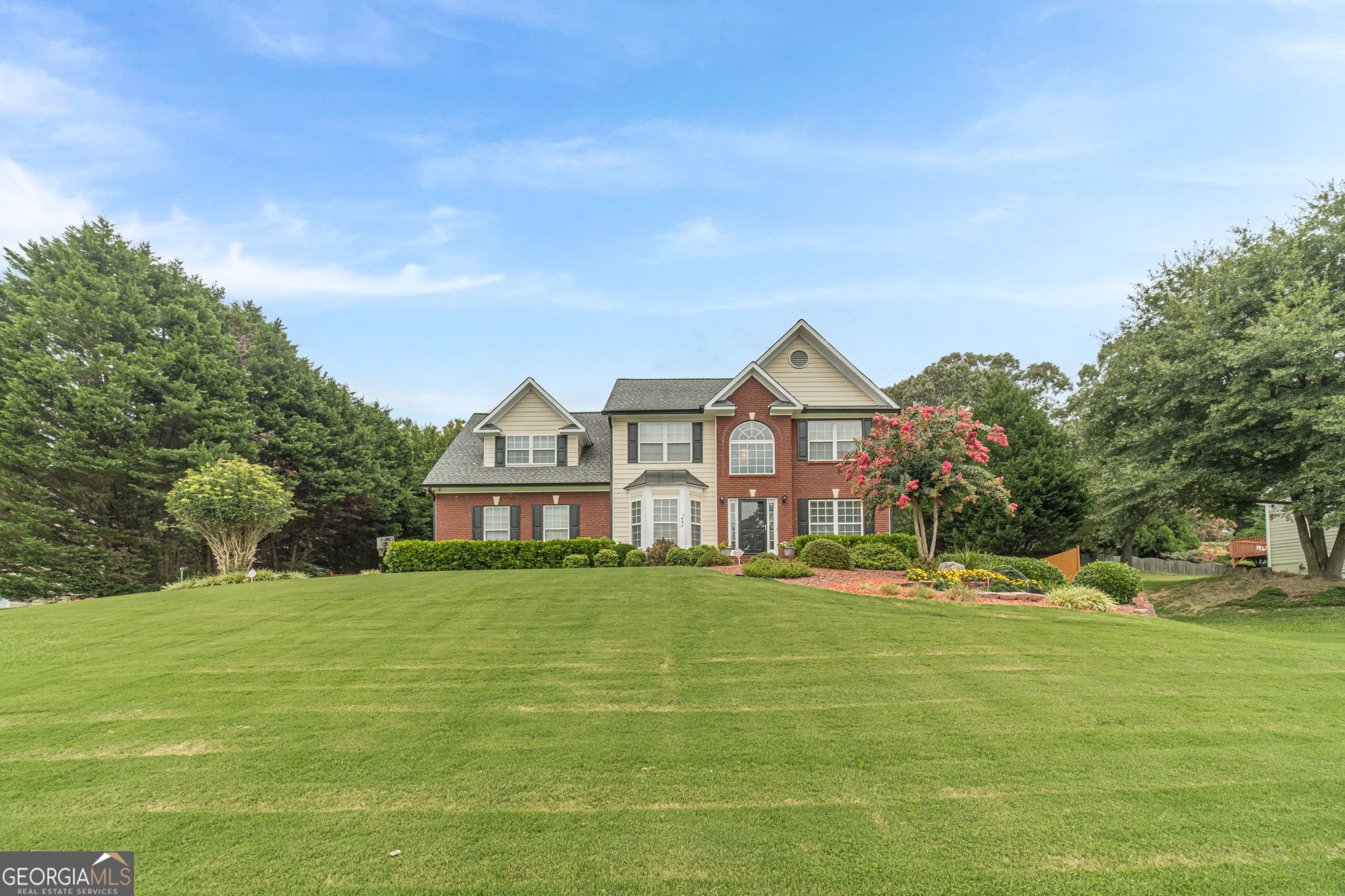 This 4BR and 2.5 BA home on a full finished basement and nearly an acre has been meticulously maintained by its original owner and is waiting for you. The brick front & beautifully manicured front yard invites you into your two-story foyer, formal living room and dining room. The main floor has a large family room with a gas fireplace, a bright kitchen with a cozy eat in area, a half bath and oversized laundry room. All four large BR's are upstairs, and the extremely welcoming primary bedroom has a tray ceiling and sitting area. Your fully finished basement is set up with a game area, exercise space, additional hang out space with a bar area and full bathroom. Your backyard oasis is the final piece that you will not want to walk away from with its deck, paved area, spacious flat land and garden. This home is just what you have been looking for!