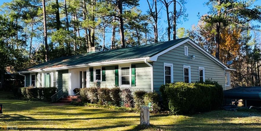 Open House Saturday Jan 28, 11:00 - 12:30 pm.   Looking for some peace and quiet and a nice view?  This 3BR/3 bath home is in a beautiful established neighborhood will not disappoint. This charming home has a HUGE sunroom that has remote skylights and a large screened in porch that also has a vent hood so you can enjoy grilling under.  You will also love looking out into your large backyard and seeing beautiful deer. Inside you have original hard wood flooring, tile flooring, two separate living areas, formal dining room, fireplace and a second master bedroom.   This home has Approximately 25 miles to Robins AFB, Perry, Eastman and 12 miles to Middle Georgia State University in Cochran. Call today to view this home!