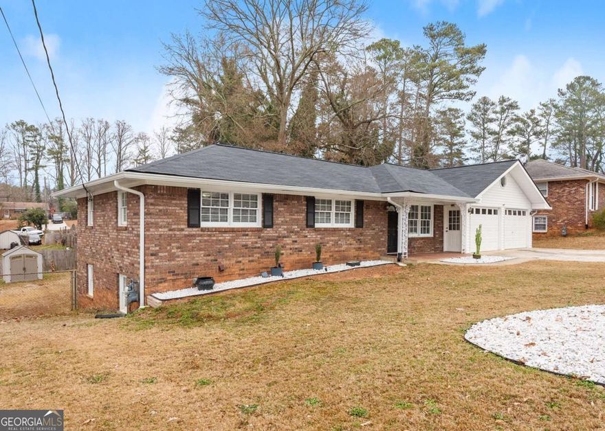 BACK ON THE MARKET - Charming Ranch-Style Home with Income Potential in Marietta!  **Appointments Only**  Discover this spacious and versatile ranch-style single-family home, perfect for multi-generational living or generating rental income. Located in the heart of Cobb County, this home offers incredible features for both comfort and opportunity.  The main floor boasts 3 bedrooms, 2 full bathrooms, and a spacious layout ideal for entertaining or relaxing. Vaulted ceilings with stunning windows fill the home with natural light, while bonus rooms provide flexibility for an office, playroom, gym, or extra storage. A newer roof ensures peace of mind.  The finished basement includes a fully equipped in-law suite or apartment with 2 additional bedrooms, a full bathroom, a new kitchenette, and a separate entrance, making it ideal for rental income or extended family living.  Blending modern convenience with timeless charm, this property is a rare find. Don't miss this incredible opportunity, call to schedule your private viewing today!