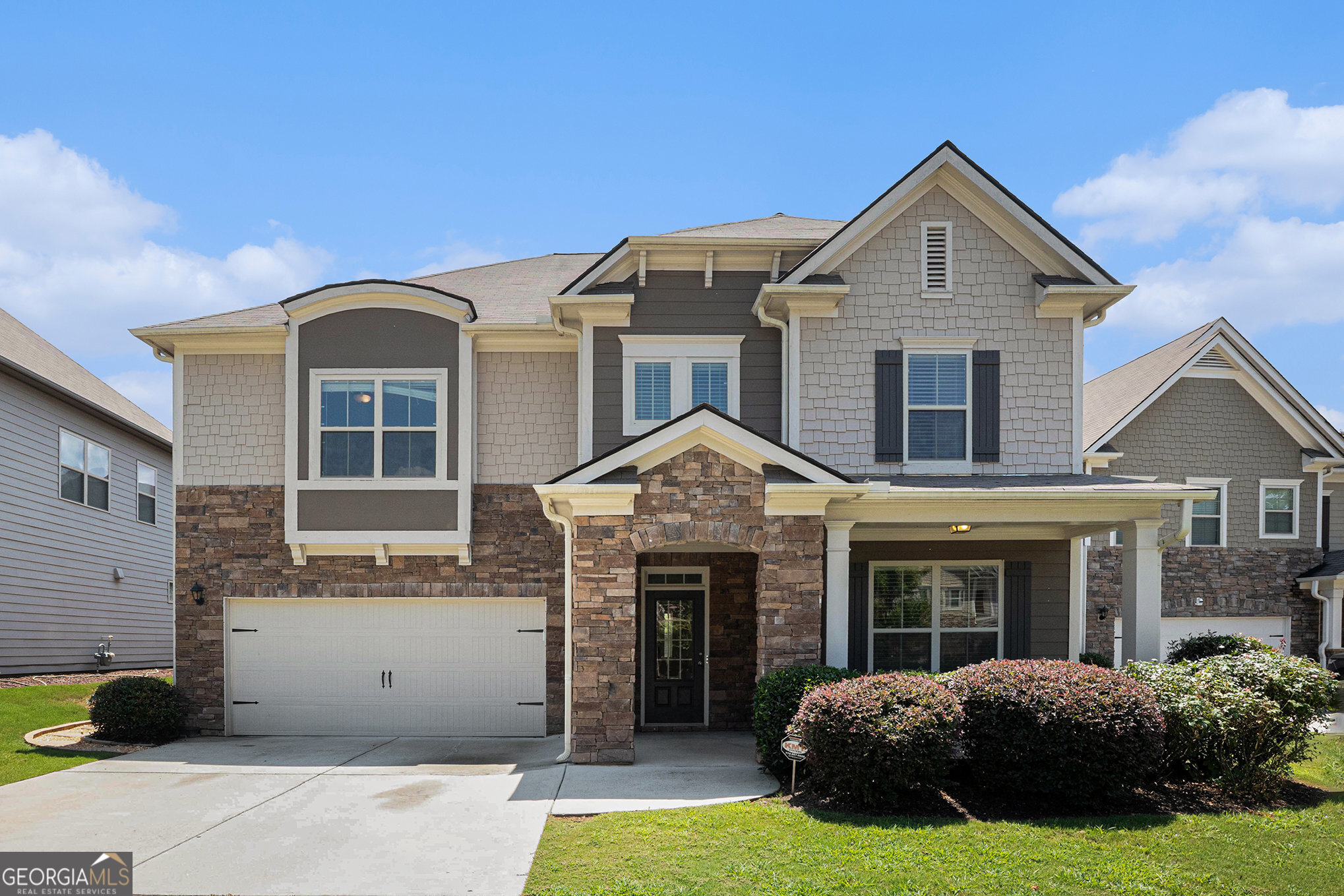 Welcome back to this beautifully updated 5-bedroom, 3-bath home in the desirable Bogan Meadows community! Enjoy a charming covered front porch and level driveway leading to a two-car garage. Inside, the open-concept layout is ideal for both everyday living and entertaining. The formal dining room flows seamlessly into a chef-inspired kitchen featuring a large island, white cabinetry, stone countertops, and stainless steel appliances-all overlooking the warm and inviting family room. A guest bedroom and full bath on the main level provide flexibility for visitors or a home office. Upstairs, you'll find four spacious bedrooms, including a generous owner's suite with a private sitting area perfect for relaxing or working from home. The spa-style primary bath offers dual vanities, a soaking tub, and a separate shower. A convenient upstairs laundry room and ample storage complete the second level. Step outside to a private, fenced backyard with plenty of space for outdoor living and play. This move-in ready home blends style, comfort, and function in a sought-after neighborhood-schedule your showing today!
