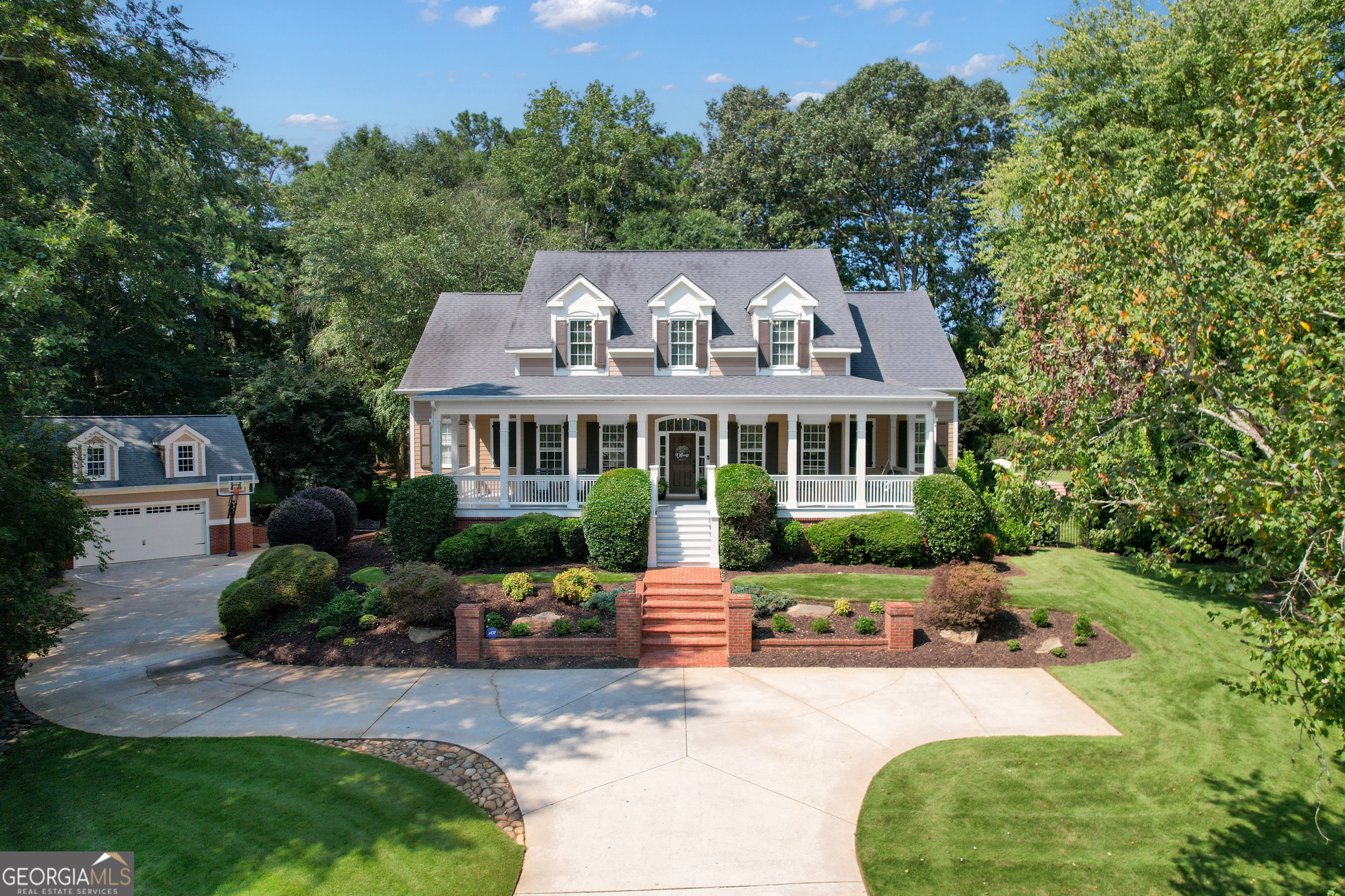 Some homes checkboxes. 115 Suffolk checks dreams. Want a saltwater PebbleTec pool and spa? Done. Five-car garage? Of course. A terrace level designed for movie marathons, billiard nights, or a private guest retreat? Absolutely. All wrapped in timeless craftsmanship, lush privacy, and a location that places you just minutes from the best of Peachtree City. From the inviting rocking chair front porch with recessed lighting to the dramatic vaulted great room with Palladian windows, every space feels crafted for both elegance and comfort. A lovely dining room with wainscoting welcomes twelve guests with ease, while the newly renovated chef's kitchen (2024) boasts custom cabinetry, a Wolf 36" electric/induction oven, Bosch dishwasher, appliance garage, oversized island, under-cabinet lighting, and sleek outlets tucked seamlessly beneath. Hardwood floors refinished in Aged Barrel (2024) flow throughout the main, complemented by fresh interior paint, crown molding, and a reimagined staircase with modern metal spindles. The "king-size" owner's retreat on the main level features a wall of windows overlooking the backyard oasis. Its spa-like bath was renovated in July 2025 with porcelain tile floors, a walk-in shower, freestanding tub, quartz double vanity, and dual custom closets with built-ins. Laundry also on the main. Upstairs, you'll find 3 spacious secondary bedrooms, 2 full baths, a computer center, and a huge bonus/playroom. The finished terrace level expands the lifestyle with a rec room, theater, billiards, guest suite, and direct access to the pool. Outdoor living takes center stage. The Trex deck with a gas grill hookup overlooks a gorgeous, private backyard retreat with a sparkling saltwater pool, spa, firepit, and open space for yard games. With room for future gardens the 1.15-acre cul-de-sac lot offers endless potential for gathering, entertaining, and relaxing. Practical upgrades abound: electric fireplace with custom built-ins (2024), tankless Rinnai water heater (2024), waterwise irrigation with 5 zones, gutter guards, three-car attached garage with workroom space, and a detached two-car garage with upper storage. The neighborhood amenities are an additional bonus with a clubhouse, swimming pool/swim team, tennis and pickleball courts, basketball, playgrounds, and walking trails-all within the outstanding Starr's Mill school district and connected by over 100 miles of Peachtree City's golf cart paths. Just minutes to The Avenue's boutiques and dining, Trilith Studios, Lake Peachtree, and top golf courses, plus 20 minutes to Piedmont Hospital and 30 minutes to Hartsfield-Jackson Airport. With the upcoming U.S. Soccer Federation Headquarters nearby, this location is unmatched. 115 Suffolk isn't just a home-it's a lifestyle, balancing everyday elegance with a resort-like retreat designed to be enjoyed year-round.