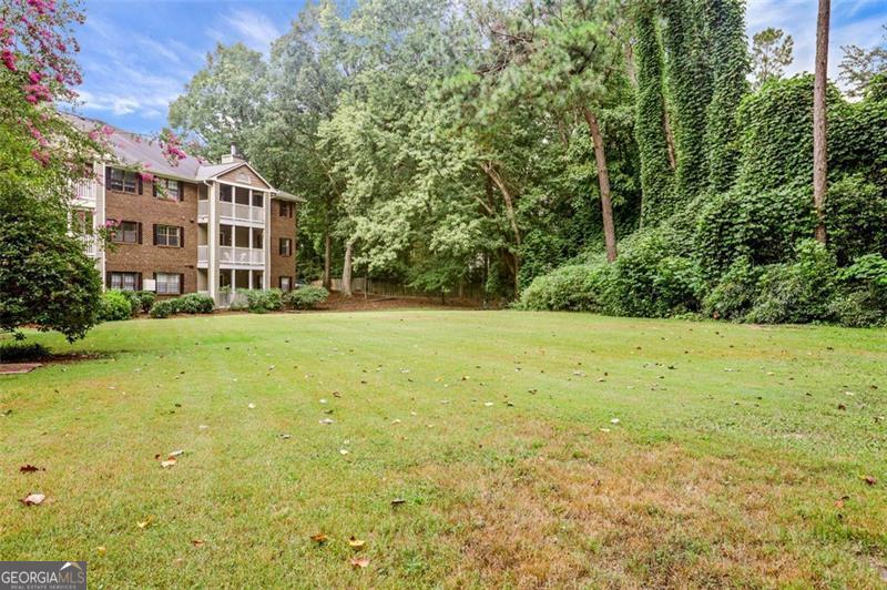 Fantastic Opportunity in Prime Sandy Springs Location! Tucked away in the charming, wooded Barrington Hills community just minutes from Morgan Falls Park, this beautifully updated ground floor main-level condo offers both comfort and convenience in a truly serene setting. Enjoy a tree-lined walk-out balcony perfect for morning coffee or evening relaxation. Inside, you'll find a completely renovated bathroom and updated kitchen. This bright, rear-facing unit is easily accessible from the parking lot, making it ideal for effortless living. Located just south of Northridge Road, you're perfectly positioned between Sandy Springs and Roswell-offering easy access to shopping, dining, and arts events in both communities. Outdoor enthusiasts will love the proximity to the Chattahoochee River and Morgan Falls Overlook Park, while commuters will appreciate the nearby MARTA stops on Roswell Road and the North Springs station just minutes away. The welcoming layout includes a cozy fireplace, open-concept living and dining area. Private balcony includes an exterior storage closet. This one-bedroom gem is just steps from the community pool and mailbox, making it as practical as it is inviting. Whether you're a first-time buyer or looking to downsize, this condo offers the perfect blend of nature, convenience, and comfort-welcome home!