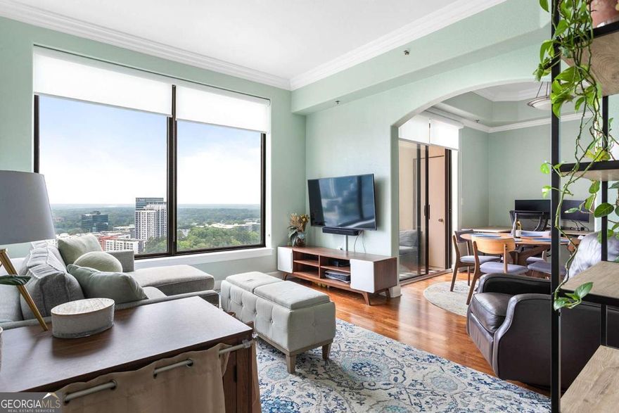Enjoy Luxury living in one of Buckhead's Finest Highrise buildings with the Stunning Western Sunset Views from  the 31st floor in the Paramount At Buckhead ! This Stunning 1 bed/1 bath condo is perfect for entertaining with  views in every room ! The Spacious kitchen with stainless steel appliances, granite countertops, double sink, staingrade cabinets and a breakfast bar. The light, bright living room features hardwood floor, crown molding, built-in  shelving and dramatic floor to ceiling windows with gorgeous views of the city, a large balcony and storage closet!  This beautiful condo also features a large romantic master suite with carpets featuring a ceiling fan, crown  molding and a spa bath with granite countertops, tile floor and shower/tub and huge walk-in california closet! This  unit is unique as it comes with a GARAGE! . Step outside of Paramount, and you're in the heart of it all. Treat  yourself to a nice massage at the Waldorf Astoria next door , easy access to MARTA to go in to town or airport,  enjoy the delights of award-winning restaurant such as NOBU, ARIA, LITTLE ALLEY STEAKHOUSE, MAGGIANO'S,  or indulge in retail therapy at Lenox and Phipps Malls. You are in close proximity to I-75, I-85, I-400 and within 15  mins to the airport. The Paramount has a unique short cut behind the building to escape all of the busy traffic on  Peachtree and directly goes to Lenox to 400!!