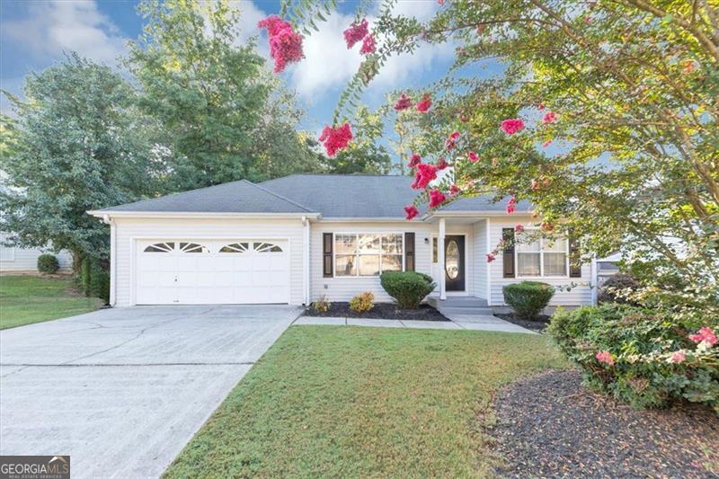 Step into a home that radiates charm and functionality from the moment you arrive. The great curb appeal sets the tone, as the home welcomes you into a bright and inviting space with soaring ceilings upon entry. Upgraded luxury vinyl flooring throughout, a cozy brick fireplace as a focal point in the living area, and a stylish kitchen featuring stainless steel appliances, white cabinets and sleek quartz countertops. Overlook the backyard from the spacious wood deck, which is fenced and offers privacy and space-ideal for entertaining, pets, or play. Schedule a tour today!
