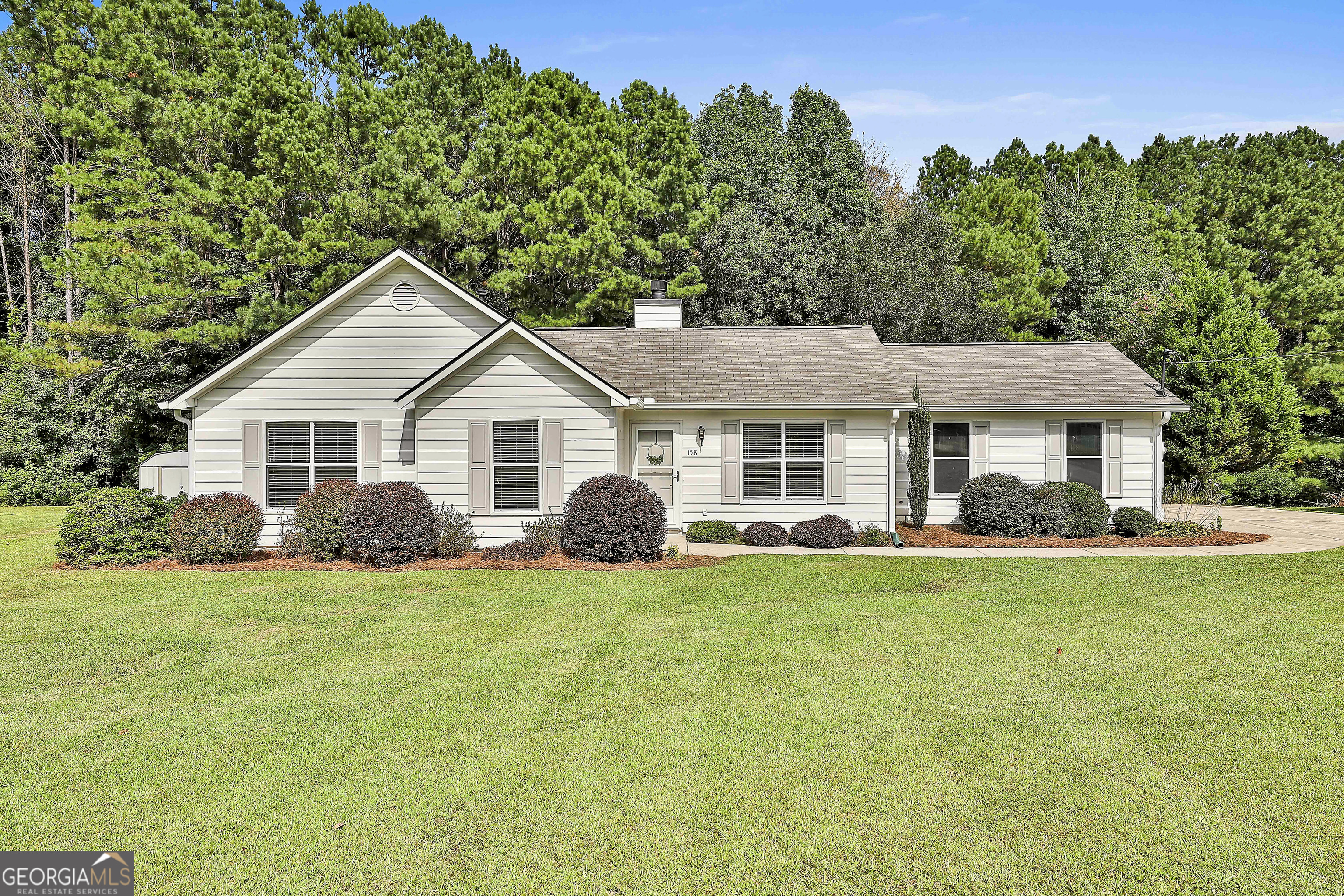 100% FINANCING USDA DISTRICT!! NORTHGATE!! NO HOA!! FRESH PAINT THROUGHOUT INTERIOR, RECENTLY PAINTED EXTERIOR, NEW HVAC, NEWER WATER HEATER, NEWER ROOF, NEW PIPING (NO POLY!!!, SEPTIC TANK PUMPED LAST YEAR & BRAND NEW STAINLESS STEEL APPLIANCES!! This 3/2 ranch is undeniably cute as a button, but here's the real win - all the big-ticket items have already been handled so you can move right in (what a relief - am I right?!?!). Step inside to the living room featuring vaulted ceilings and a cozy gas fireplace. Living room is open to the dining room and kitchen which features granite countertops, a brand-new stainless steel dishwasher, and a brand-new stainless steel gas oven. My favorite part? The walk-in pantry/laundry room with custom shelving that makes staying organized actually enjoyable! Down the hall, don't miss the versatile storage closet with custom built-ins - it's as functional as it is adorable. The primary suite is generously sized with vaulted ceilings and a private bathroom featuring granite countertops, a vanity space, a garden tub/shower, and a walk-in closet with even more custom built-in shelving!!! Secondary bedrooms are spacious, and the secondary bathroom also features granite countertops. Step outside to your HUGE, recently refinished grill deck/porch with new railings, overlooking a large, nearly 1-acre lot (.8+-). And just in time for football season-this is the spot to fire up the grill, cheer on your team, and host the ultimate tailgate at home. Whether it's friends gathered for Saturday kickoffs, pets running around at halftime, or just enjoying a quiet evening in, you'll LOVE this outdoor space. Top it all off with the unbeatable location - just minutes to the interstate and the brand-new Publix shopping center - this home is the perfect blend of character, convenience, and peace of mind. All that's missing is you! Schedule your showing today!