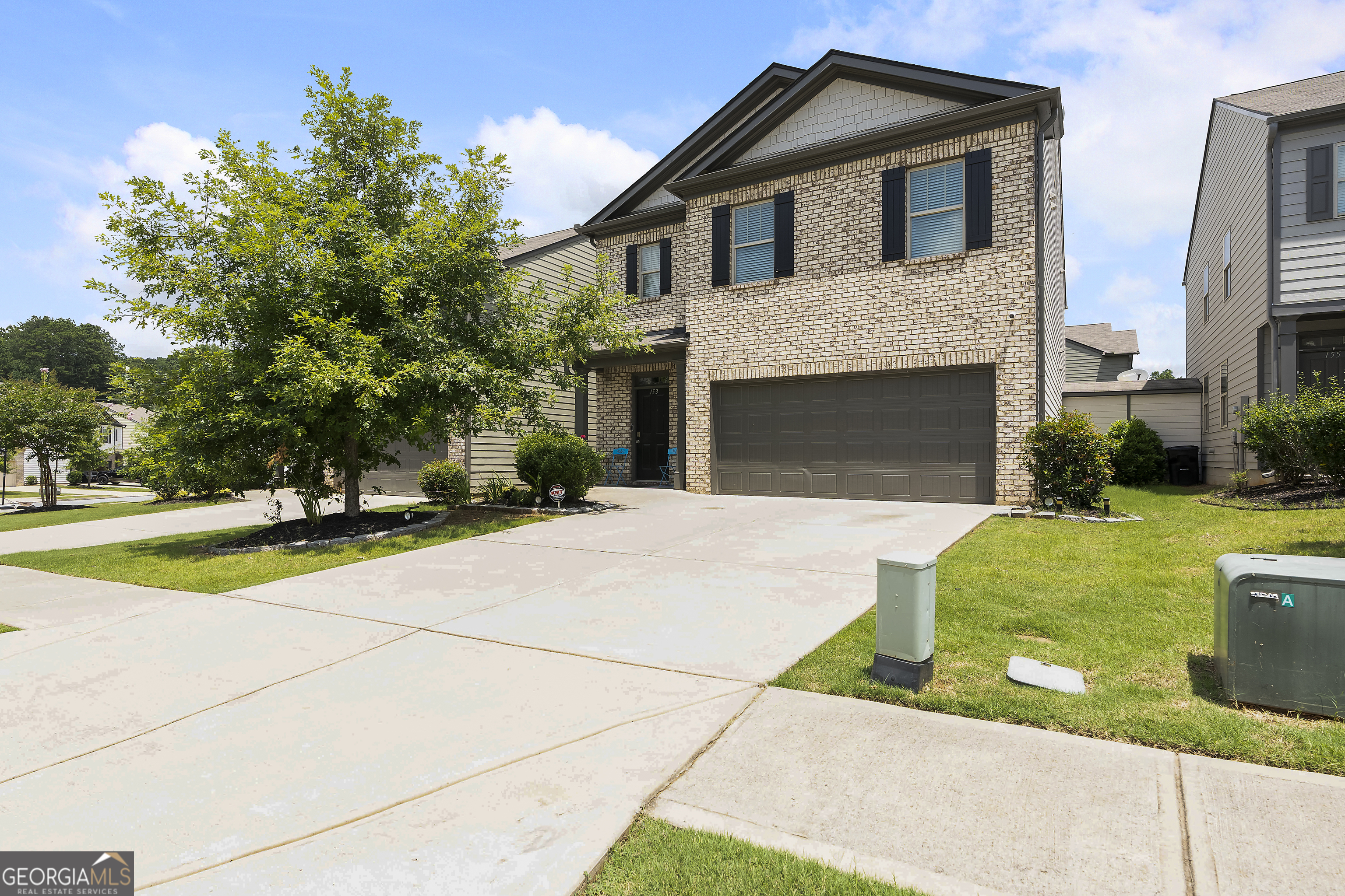 Welcome to this amazing 5 Bedroom, 3 full bath home built in 2019 home boast an open concept floor plan with: gorgeous luxury vinyl plank floors, spacious family room with fireplace, large dining area, gourmet kitchen with tons of cabinets, stainless steel appliances, beautiful granite countertops & an oversized island/breakfast bar with pendant lights. There is a guest bedroom with full bath on the main. Upstairs you'll find a a large master suite featuring a master bath that has double vanities, a large shower & generous closet space. Secondary bedrooms are spacious. Home sits on on private fenced lot. Storage room in back. HOA fee includes yard maintenance! Close to award winning schools, shopping, parks/trails, restaurants. LOTS of square footage for the money! Very convenient to I-75 & I-575