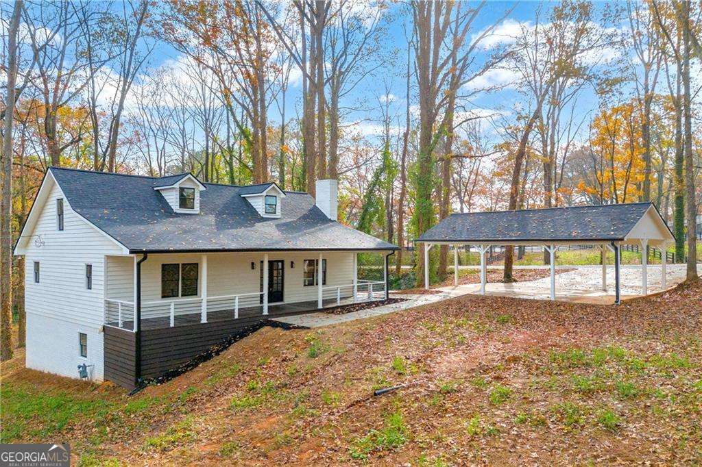 Welcome to this exquisite, fully remodeled three-story home, nestled in the highly coveted city of Milton. No detail has been overlooked in the design and finishes of this stunning property, where luxury meets functionality at every turn. Sitting on over an acre of beautifully landscaped land as you step inside, you are immediately greeted by a spacious, open-concept layout that seamlessly connects the family room and kitchen. The focal point of the family room is the striking custom-built fireplace. The kitchen has been thoughtfully remodeled with custom countertops and expansive white soft-close cabinetry, offering an abundance of storage. The entire main level of this home features two generously sized bedrooms and two full baths. The master suite offers a private retreat, complete with a custom-designed bathroom that provides a peaceful oasis while still offering ample living space. The main level flows effortlessly, showcasing brand-new flooring, a remodeled kitchen, and beautifully updated bathrooms, all enhanced by fresh paint and stylish new light fixtures. Upstairs, you'll find two additional bedrooms, separated by its own private bathroom, creating the feel of two distinct suites for ultimate privacy and convenience. This also boasts a fully finished basement with both interior and exterior entry, offering privacy and versatility. The basement features its own separate access pathway to the garage, making it ideal for in-laws, overnight guests, or even a rental opportunity. Inside, you'll find a custom-built kitchen, a spacious bedroom with a walk-in closet, a beautifully designed bathroom, and a comfortable living area. Additionally, a large storage room is tucked away at the end of the basement, complete with its own private entry. This home also has a spacious three-car covered carport, built on a brand-new, expertly poured concrete foundation to maximize driveway functionality. Everything in this home has been meticulously replaced and updated to offer a completely fresh, modern living experience. From the brand-new roof, HVAC system, electrical, and plumbing to the stunning new floors, fresh paint, and newly poured concreteCono detail has been overlooked. This is truly a "new" home, without the new construction price tag. The property is a showstopper, straight out of a home and garden magazine or an episode of HGTV, with every corner thoughtfully designed and perfectly executed. It's the ideal combination of style, functionality, and value, waiting for you to call it home.