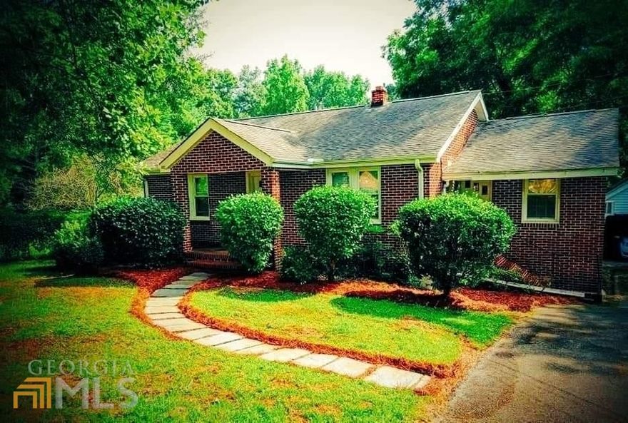 Look at this wonderful home. Check out this mini farm in town. Brick house with 2 -3 bedrooms and 2 baths on 1.4 acres. Fabulous property with ample storage buildings and a workshop with power and water. This property has produced one of the best gardens and has apple, pear trees and blueberries. Property is fenced in and the open garage is attached to the large workshop. Updated windows and HVAC. Inside the home you will find the beauty of original hardwood floors and some vintage lighting. Large living room and an additional family room. Two bedrooms and recently renovated bath are on one side of the house and the additional bedroom and bathroom located on the other. Third bedroom is downstairs. House has an abundance of windows allowing natural light to surround the home. Kitchen features a large pantry and dining area. This house is move in ready. Just waiting for you to call it home. You get all this and its conveniently located to town. Schedule a showing today.