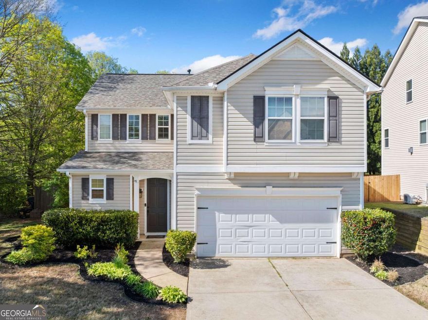 Welcome to a wonderful gem in a vibrant community, where comfort, convenience, and connection await. With recent updates including a 2-year-old roof, on-demand water heater, and 1-year-old HVAC, this home is ready and waiting for your personal touches.    Inside, you'll find a spacious kitchen that opens up to a bright dining area and inviting living room. Sliding glass doors let in plenty of natural light, leading you to a private, fenced backyard perfect for morning coffee, weekend gatherings, or relaxation. The nearby wooded lot adds to the sense of seclusion and calm.    The oversized primary bedroom is a serene retreat, featuring a generous walk-in closet and a spacious bathroom with a natural view. Two additional bedrooms share a cheerful hall bath, ideal for guests, kids, or a home office.    You'll enjoy being just a short stroll from the community's fantastic amenities, including a pool, playground, and tennis courts. Plus, with GA-400 just two minutes away, you'll have easy access to shopping, dining, and commuting.    Whether you're starting fresh or seeking a low-maintenance lifestyle in a well-loved home, this property offers the perfect balance of practicality, potential, and peaceful living.