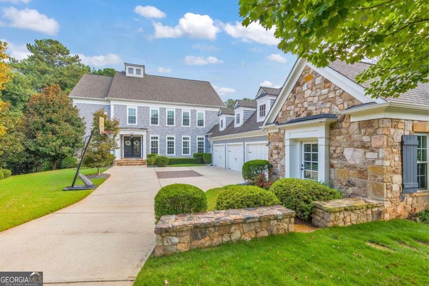 Enjoy the best that East Cobb has to offer! Experience the pinnacle of suburban living in this breathtaking 6 bed / 6.5 bath home nestled in an exclusive 5-home community within the sought-after Pope High School district. This residence offers a true outdoor oasis with a heated saltwater gunite pool, spa, and breathtaking lake views. Entertain around the fire pit, relax on the lower patio, or enjoy the screened-in upper porch with a gas line - ideal for year-round living. Step inside to an immaculate home that showcases thoughtful attention to detail at every turn. The living room features coffered ceilings, custom built-ins, and a gas log fireplace, seamlessly flowing into the gourmet kitchen. Equipped with high-end Thermador appliances, including a 6-burner gas cooktop with a griddle and double ovens, the kitchen also offers a large island, granite countertops, and a breakfast area overlooking serene lake views. Additional features include a pantry with wood shelving and a butler's pantry with granite countertops. Retreat to the primary suite that boasts tray ceilings and a spa-like bathroom with his and hers vanities, a soaking tub, separate shower, and custom closets. All bathrooms feature granite counters. The finished basement includes a media room with a built-in mini fridge, a bedroom, a full bath, and a home gym, along with a storage closet outfitted with Elfa shelving. The three-car garage features a bonus room, perfect for an office, gym, or extra storage. Other features include transom windows and Nest thermostats. Exterior updates include professional lighting with timers, a professional drainage system, and an irrigation system. The Five Lakeside community fee covers landscaping and boasts its own private park for homeowners, providing an ideal space for relaxation and recreation. Residents can also enjoy fishing on the stocked lake. Don't miss this rare opportunity to own a truly one-of-a-kind home, offering an unparalleled living experience in a breathtaking setting.