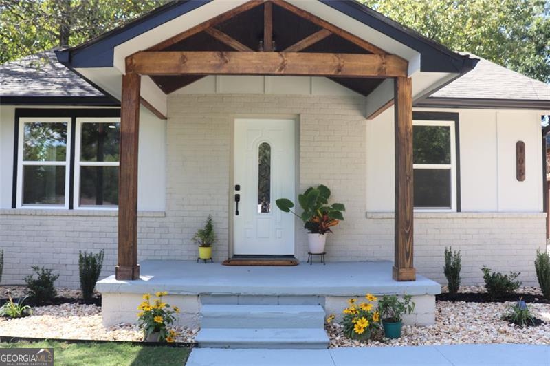 Welcome to this beautifully updated home offering the perfect blend of style, comfort, and convenience-with no HOA restrictions. Enjoy the curb appeal of brand-new panel siding and a striking new brick front. Step inside to discover an open floor plan, featuring a renovated kitchen with sleek quartz countertops, tile backsplash, and brand-new appliances. Enjoy peace of mind with a new HVAC, water heater, windows, lighting fixtures, and a two-year-old roof. Out back, relax or entertain in your fenced private yard, complete with a new grill and solar-powered gate leading to ample rear parking. The level lot makes maintenance a breeze, and the location is very convenient-just minutes from UNG, I-985, and all the dining and shopping Gainesville has to offer. Whether you're looking for a primary residence or a highly rentable investment, this home checks every box.