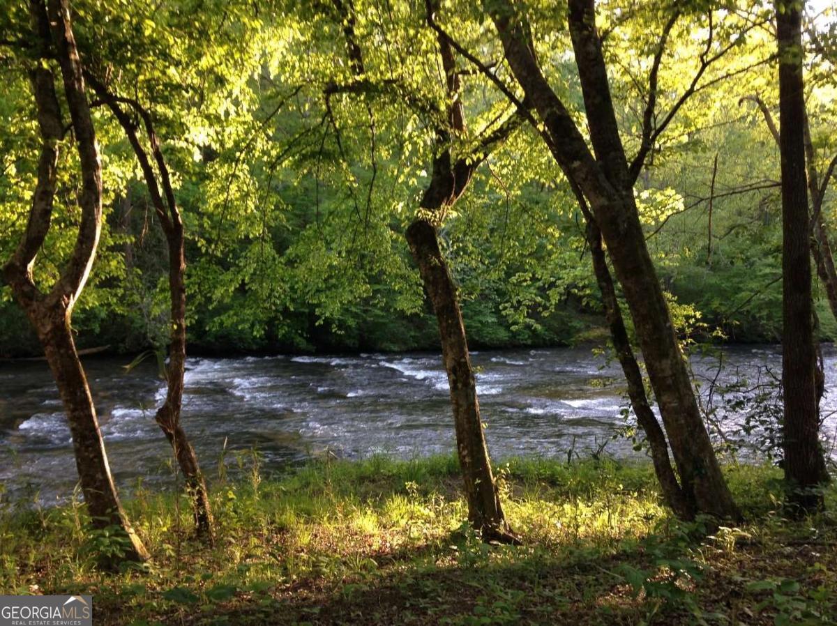 ETOWAH RIVER FRONTAGE END OF RD PRIVATE RETREAT ON 19.9 ACRES, NESTLED IN SECLUSION OF SERENITY.WATCH/HEAR/WADE THE GLISTENING SHOALS OF THE RIVER... SPEND YOUR SUMMERS DOWN RIVER.. FLOAT/KAYAK/GOLD PAN/CAMP WITH YOUR FAMILY & FRIENDS ON 19.9 ACRES..PROPERTY IS LEVEL BY THE RIVER & VIEWS are AWESOME AS WELL AS THE WATER FLOW AND SOUND... PERFECT FOR VRBO YURTS/CABINS/COTTAGES/RETREAT ETC OR YOUR PRIVATE ESTATE LOCATED JUST 10 MIN FROM GA 400. DAHLONEGA & DAWSONVILLE PROPERTY VIDEO AVAILABLE ON Youtube...DOWN RIVER.. https://youtu.be/q7UpFcSBEFA... ..BROKER/OWNER