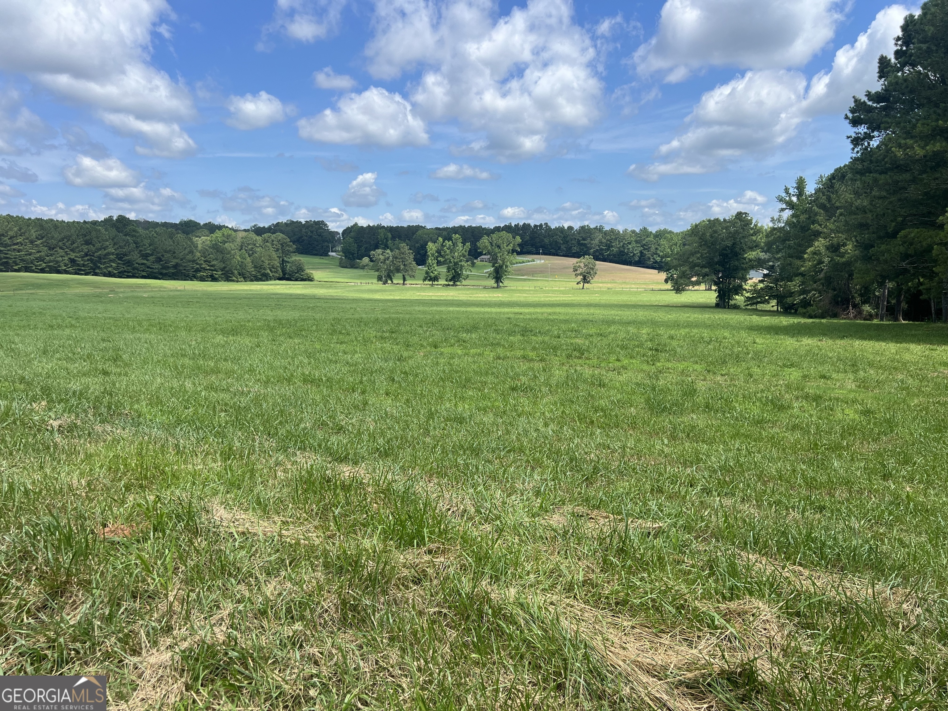 Lush open pasture land awaiting your new home design! Located in Heard County, GA this property offers access to a wonderful school system. Heard County is a rural environment but with a wealth of resources being allocated to the county school system. This truly is a perfect place to raise a family or retire! The close proximity to major highways provides a very doable commute to all surrounding areas and even to the ATL airport and metro area. This land rises from the road very gracefully, for a perfect site for exceptional front elevations. A new survey will be provided. Each of the 2 tracts available shall contain approximately 7 acres, at this time there is an adjacent tract available. The frontage is on the lovely little gravel Unity Road and you are just a few hundred feet off of the paved Roosterville Road.