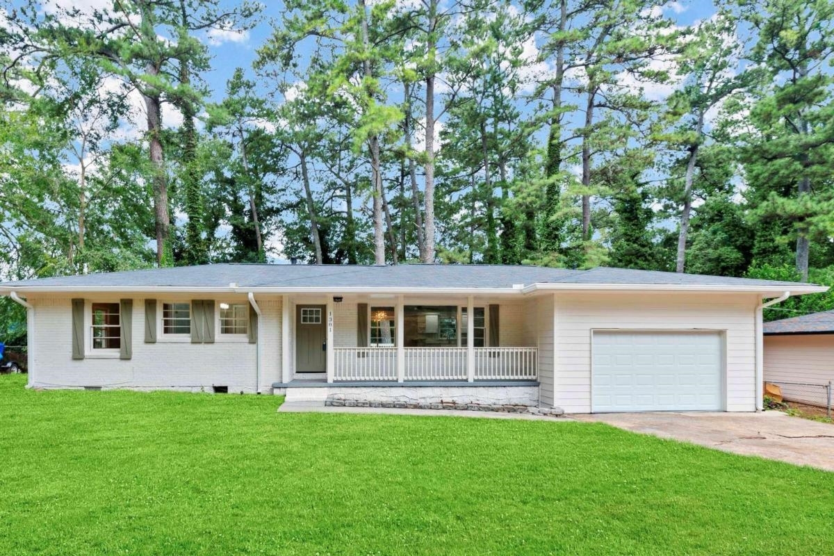 Absolutely gorgeous, fully renovated, 3 bedroom, 2 bath 4 sided brick ranch. This home features open floor plan, refinished hardwood floors and a new deck. Amazing open kitchen with new stainless steel appliances, granite countertops and new cabinets. Fresh paint, new light fixtures throughout and lots of natural light. Park comfortably in the attached 2 car garage with a long driveway to accommodate additional parking. Conveniently located to major highways. Minutes away to Avondale Estates, Stone Mountain, East Lake and Downtown Decatur. Wont last long!