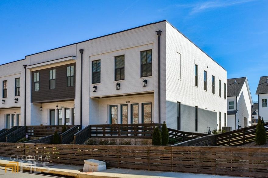 Gorgeous 2 story end unit townhome. This townhome offers open concept w/tons of natural sunlight. Kitchen offer tons of cabinets, under mount counter lighting, a large walk-in pantry, ss appliances, gas stove & large waterfall granite island. Open concept to family room area & dining/dinette area. The main floor offers custom shades w/remote are programable for time of day open/close or just use the remote for time of day privacy. Sit on your brick paved front porch that is fenced in & landscaped all cared for as part of HOA fees. The master suite is spacious w/an extra large walk-in closet that is also attached to the laundry room. Laundry room also has entrance from hall on second floor for the secondary bedrooms. Master bath offers double sinks & seamless walk-in shower w/sitting spot. The secondary bathroom also offers double sinks separate from commode & tub/shower. Secondary bedrooms are spacious as are the closets. Carpet in the bedrooms only! The community pool is only a couple of doors down across the street & the community park with walking trails is a very short walk to for children or pets. Just a mile walk to the Town Center Commons for dining out and entertainment. Everything is at your fingertips.