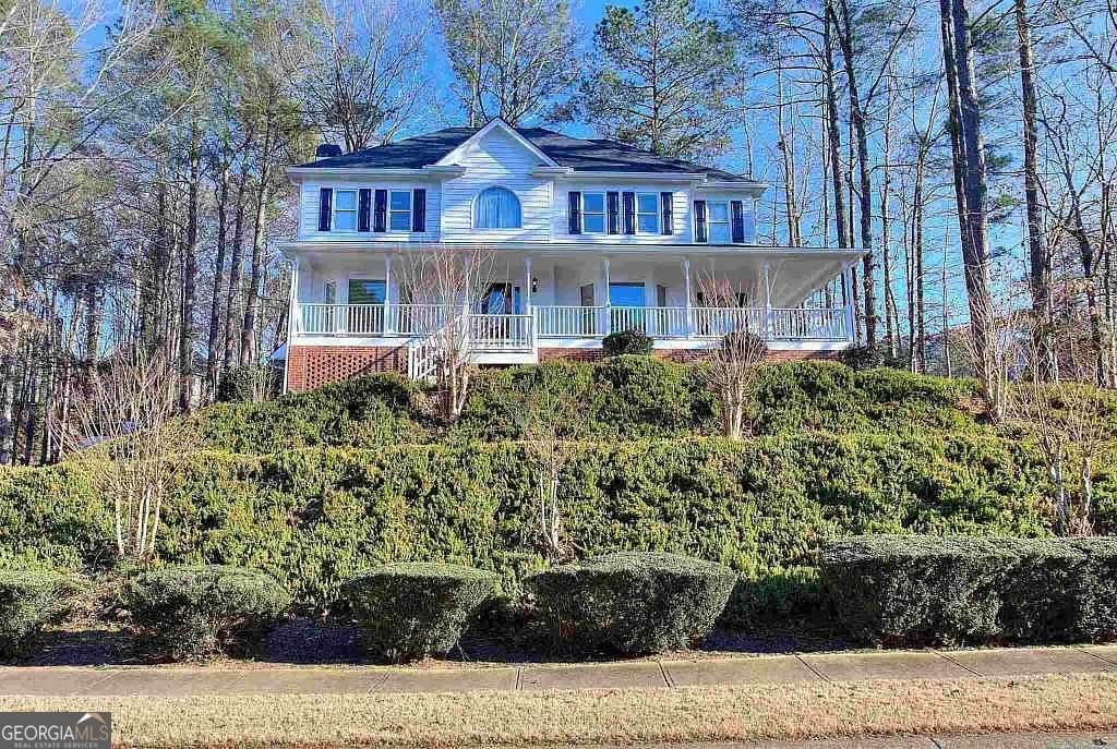 Beautiful Charleston-style home located in a desirable swim/tennis community in Woodstock. This spacious property offers exceptional curb appeal, functional living spaces, and a lifestyle centered around comfort and convenience. PROPERTY FEATURES: * Two-story foyer with hardwood floors throughout the main level * Separate living and dining rooms, ideal for entertaining or flexible use * Family room with a classic brick fireplace * Kitchen with ample cabinetry and breakfast area * Spacious primary suite with walk-in closet * Secondary bedrooms with generous closet space * Finished basement featuring two additional rooms and a full bath, perfect for office or recreation * 2 car garage * 4 bedrooms/ 4.5 bathrooms COMMUNITY & LOCATION HIGHLIGHTS: This area offers quality of life. Residents enjoy access to swimming, tennis, and neighborhood amenities in a highly sought-after community. Two-minute drive to Eagle Watch Golf Club (separate membership). This Woodstock neighborhood provides access to the Cherokee County School District (Bascomb Elementary, E.T. Booth Middle School, Etowah High School), boutique shopping, dining, and easy access to major highways for commuting. * 20 miles north of Dobbins Air Reserve Base * 32 miles north of downtown Atlanta. * 40 miles north of Hartsfield-Jackson Airport. Income verification, credit and background checks required. Please complete the RentSpree application.