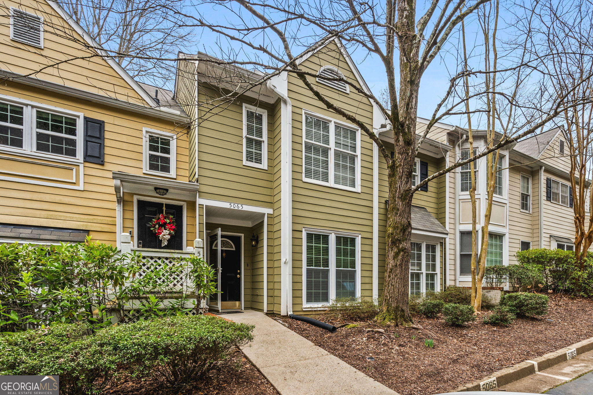 NEW PRICE and NEW PAINT!! Nestled in a vibrant community that beautifully marries modern amenities with timeless charm, this unique two-story townhome is a true gem. From its thoughtfully designed interiors to the lush, inviting community spaces, this residence offers a lifestyle of comfort and sophistication. Upon entering the home, you are greeted by an expansive two-story family room that serves as the heart of the home. Its soaring ceilings and generous windows flood the space with natural light, creating a warm and welcoming ambiance. The focal point of this room is the cozy fireplace, perfect for gathering with family and friends on chilly evenings. Adjacent to the family room is a dining area that seamlessly blends into the kitchen. The kitchen itself is a culinary enthusiast's dream, featuring a pass-thru window that opens to the family room, fostering an ideal space for entertaining. This kitchen is both functional and stylish. Completing the main level is a spacious primary bedroom suite. A full bath on this level ensures convenience and privacy. Easy Access to the laundry on the main floor too! Ascending to the upper level, you will discover a second primary suite, a private sanctuary designed for relaxation and rejuvenation. The en-suite bath is a highlight, featuring a luxurious soaking tub and a separate walk-in shower. This space is a haven where you can unwind and escape the stresses of the day. The upper level also boasts a versatile bonus room. This space is brimming with potential, whether you envision it as a wrapping room, study nook, or an art studio. The possibilities are endless, allowing you to tailor the space to your unique needs and lifestyle. Step outside to your private courtyard, a tranquil oasis where you can enjoy your morning coffee or an evening glass of wine. This intimate outdoor space is perfect for quiet reflection, reading a book, or hosting a small gathering. The townhome is situated in a community that offers abundant green spaces, providing a peaceful environment for outdoor activities and leisurely strolls. Residents have access to a swimming pool, perfect for cooling off on hot summer days, and tennis courts for those who enjoy staying active. Don't miss the chance to make this enchanting townhome your own and enjoy a life of comfort, convenience, and elegance. Close to Ga 400, shopping and restaurants! Walk to Starbucks, Publix, Orange Theory and a plethora of restaurants!!