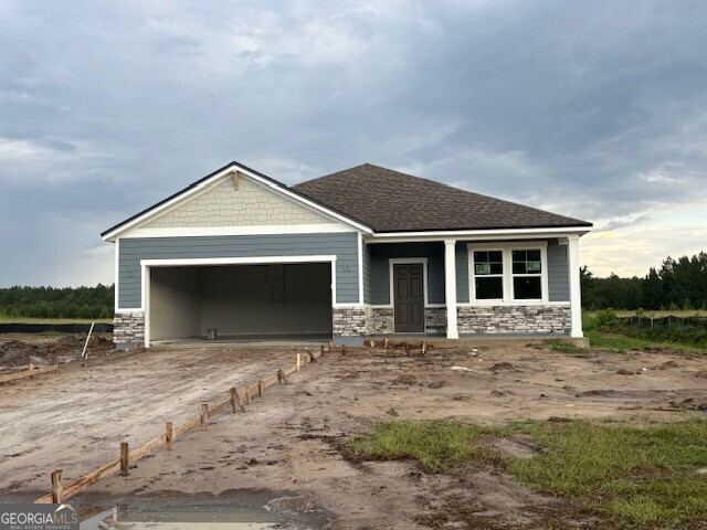 For undeniable style and versatility, choose this brick exterior Champlain plan. Welcome to our Brand New Gated Community...Northshore On The St. Mary's River. This 3 Bed, 2 bath, 2 Car Garage 1786 sq ft One Story Single Family Home on over 1/2 acre (.73 Acres) is ready for an September/October Completion date. This home has it all being on a huge estate lot in a gated community that backs up to a pond. This home has a huge backyard with a large amount of open space back to your pond. Quartz throughout including kitchen, primary bathroom and secondary bathrooms, LVP flooring everywhere except the bedrooms, Shaw carpet in the bedrooms. Kitchen has tiled kitchen backsplash along with tile throughout in the primary bathroom. Whirlpool Stainless steel appliances in Microwave, range/oven, and dishwasher. Interior has a nice office with two French Doors off to the side once you walk into the home. The exterior of this Champlain Floor Plan will have a nice front covered porch with exterior stone as well as a covered rear lanai. Acreage, Acreage, Acreage! Northshore community, having estate size lots, has a community outdoor screened clubhouse, boat access with a dock, playground, basketball court, front and rear gates and is very private and secluded along the St Mary's River. Colors and Options may vary. Contact onsite sales with questions.