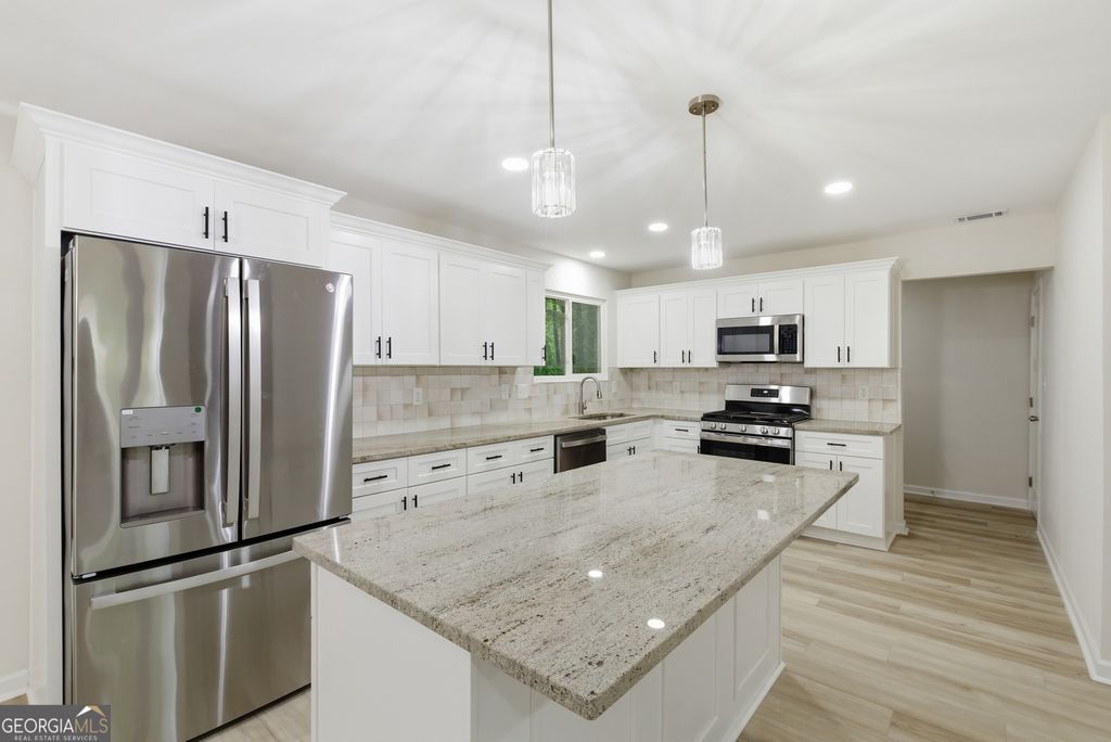 Photo of 5006 Galbraith Circle, Stone Mountain, GA 30088 (MLS # 10755985)