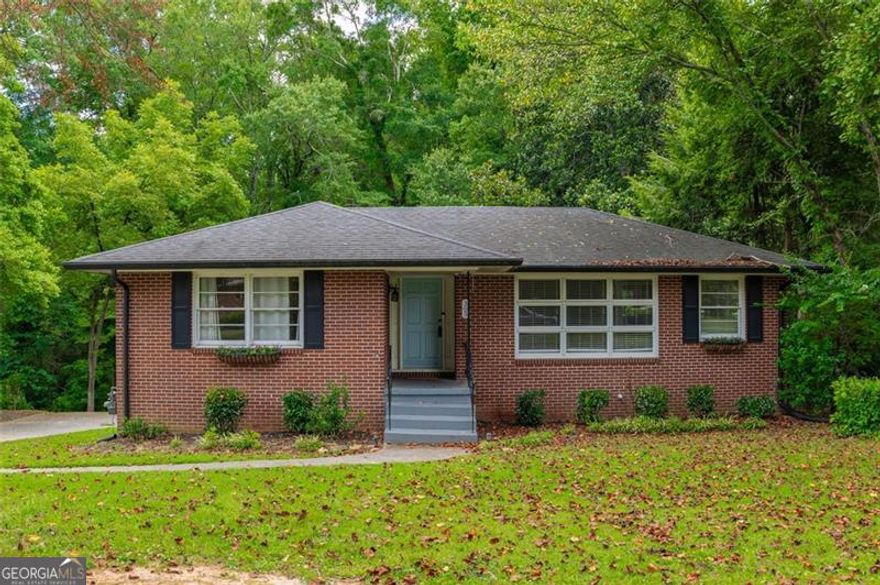 Location, location, location!!! Welcome to 305 Brookwood Dr - an updated mid-century ranch just minutes from the vibrant shops, dining, and events of Marietta Square. This charming home combines classic character with modern updates, offering comfortable living inside and out. The main level features a bright, open layout with stylish finishes and warm hardwoods throughout. Step out back to enjoy a view of your entire back yard from a large deck with stair access to below. Downstairs, you'll find a finished basement complete with its own full bathroom-perfect for a roommate, in-law suite, or flexible bonus space. Outside, enjoy the peaceful view of a running creek that borders the property. A portion of the yard is fully fenced, making it ideal for pets to roam safely. Whether you're relaxing on the back patio or exploring the nearby square, this home offers the perfect blend of privacy, convenience, and charm. Don't miss your chance to own this move-in ready gem in one of Marietta's most desirable locations! Motivated seller, bring an offer!