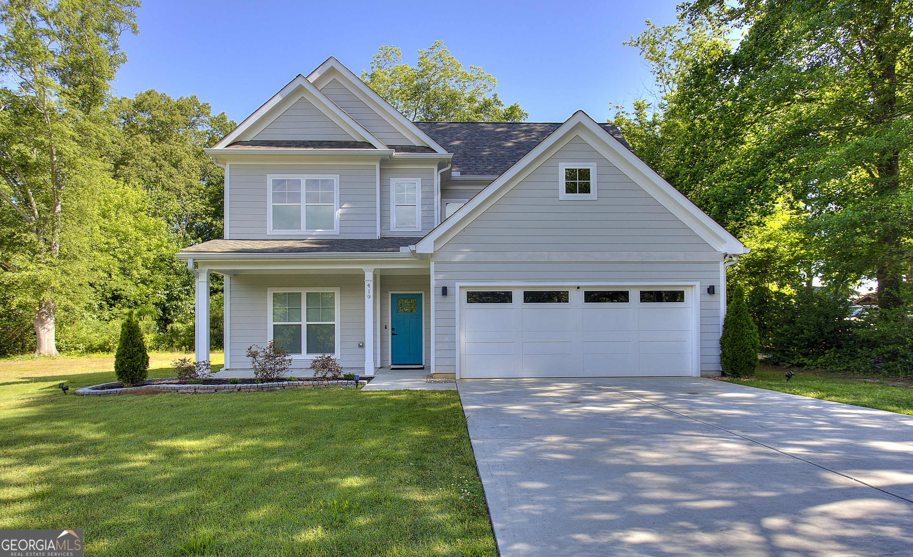 Introducing a beautifully maintained, like-new home in the desirable Smyrna/Marietta area, quietly nestled on a cul-de-sac street. Built just two years ago, this craftsman-inspired residence features a functional and stylish layout with a separate dining room, engineered luxury vinyl plank flooring throughout the main level, and an open-concept kitchen outfitted with quartz countertops, stainless steel appliances, and an upgraded waterfall island. The adjoining family room with a cozy fireplace offers generous space for both relaxation and entertaining. Double doors lead from the main living area to a covered patioCoperfect for outdoor dining or loungingCooverlooking a level, landscaped backyard. Upstairs, the ownerCOs suite with trey ceilings provides a peaceful retreat complete with a beautifully appointed en-suite bath featuring dual vanities, a garden tub, a tiled shower with glass doors, and modern fixtures. Two additional spacious bedrooms share a well-designed hall bath. The upstairs laundry includes a quartz countertop, tile backsplash and cabinetry to neatly store and conceal cleaning products. Thoughtful upgrades to lighting, hardware, and finishes further enhance the homeCOs modern aesthetic. This impeccably maintained and move-in ready home is ideally located just minutes from the shops, dining, and events of Marietta Square. A rare find in an established neighborhood. Schedule your private showing today.