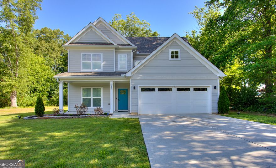 Introducing a beautifully maintained, like-new home in the desirable Smyrna/Marietta area, quietly nestled on a cul-de-sac street. Built just two years ago, this craftsman-inspired residence features a functional and stylish layout with a separate dining room, engineered luxury vinyl plank flooring throughout the main level, and an open-concept kitchen outfitted with quartz countertops, stainless steel appliances, and an upgraded waterfall island. The adjoining family room with a cozy fireplace offers generous space for both relaxation and entertaining. Double doors lead from the main living area to a covered patioCoperfect for outdoor dining or loungingCooverlooking a level, landscaped backyard.    Upstairs, the ownerCOs suite with trey ceilings provides a peaceful retreat complete with a beautifully appointed en-suite bath featuring dual vanities, a garden tub, a tiled shower with glass doors, and modern fixtures. Two additional spacious bedrooms share a well-designed hall bath. The upstairs laundry includes a quartz countertop, tile backsplash and cabinetry to neatly store and conceal cleaning products. Thoughtful upgrades to lighting, hardware, and finishes further enhance the homeCOs modern aesthetic.    This impeccably maintained and move-in ready home is ideally located just minutes from the shops, dining, and events of Marietta Square.  A rare find in an established neighborhood. Schedule your private showing today.