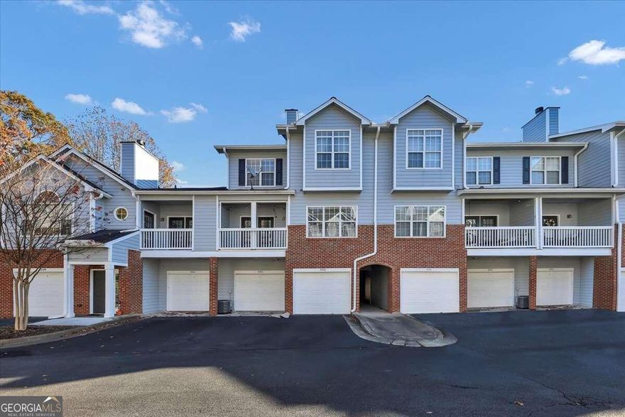 Welcome home to this inviting multi-level condominium. The attached oversized double-car garage not only ensures ample space for your vehicles but also offers abundant storage space. Upon entering the foyer on the lower level, a convenient coat closet enhances the practicality of this well-designed space. Ascend the steps to the main living area, featuring a spacious living room, dining room, enclosed patio, updated kitchen, and a dedicated laundry room. A half bath and a cozy nook for a desk or bench add to the functionality of this level. The well-appointed kitchen comes complete with stainless steel appliances. The home also includes a washer and dryer for added convenience On the third level, discover the primary and secondary bedrooms, The bedrooms and bathrooms have been recently renovated for added luxury. The primary bedroom impresses with a double-door entry, vaulted ceilings, and a walk-in closet. The bathroom is a retreat in itself, featuring granite countertops, dual vanities with a glam area, and tasteful upgrades. Enjoy peace of mind knowing that the HVAC system was replaced in 2019. Located in the gated community of Vinings Forest, residents have access to a swimming pool complete with a pool house and a newly-built dog park. The community is conveniently located minutes to the Battery, Cumberland Mall, Taylor-Brawner Park, Smyrna Market Village, a variety of restaurants, and I-285. Embrace a lifestyle of comfort and convenience in this desirable condominium in a highly sought-after location in Smyrna!