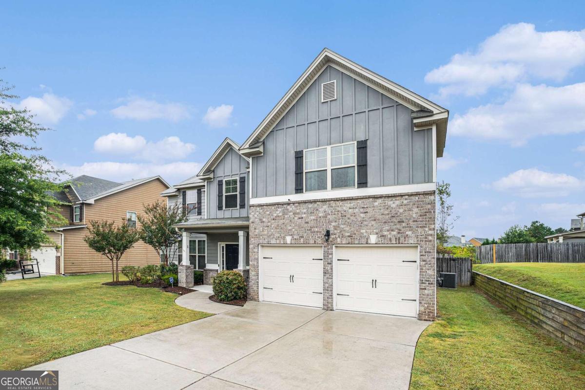 MOVE-IN READY home in the desirable Fall Creek Swim and Tennis Community! This charming Craftsman-style home welcomes you with a grand two-story foyer. The first floor boasts brand new hardwood flooring, two spacious living areas, a formal dining room that comfortably seats 12+, and an open-concept eat-in kitchen that flows into the cozy living room with a fireplace. The kitchen features a center island, pantry, granite countertops, and stainless steel appliances. A convenient half bath is also located on the main level. Upstairs, you'll find four generously sized bedrooms with vaulted ceilings and two full baths. The master suite includes a large sitting area and an oversized walk-in closet. The master bath offers granite double vanities, a garden tub, and a separate shower. Additional highlights include a two-car garage, a private FENCED BACKYARD with a patio and a storage shed for all your lawn equipment. Located near shopping, restaurants, schools, and Highway 78, this home is a must-see! Schedule a viewing today!