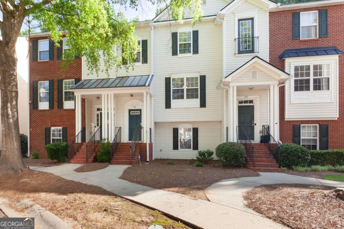Welcome home to this beautifully updated 2-bedroom, 2.5-bath townhome nestled in a quiet, wooded community in vibrant Woodstock! From the moment you step inside, you'll appreciate the fresh paint and brand-new flooring that flows throughout the entire home, creating a clean, modern feel. The spacious kitchen features sleek stainless steel appliances, including a brand-new stove and dishwasher, along with updated lighting and fixtures that add a touch of style. Enjoy peace of mind with a new water heater, new garbage disposal, and newer HVAC system for year-round comfort. The home also includes programmable thermostats and a security alarm system for added convenience and safety. Master bath features updated lighting and paint. Both bedrooms offer generous closet space, while the wooded backyard view provides a serene setting perfect for morning coffee or evening relaxation. Located just minutes from downtown Woodstock's shopping, dining, and entertainment, this move-in-ready townhome offers the perfect blend of comfort, convenience, and community.