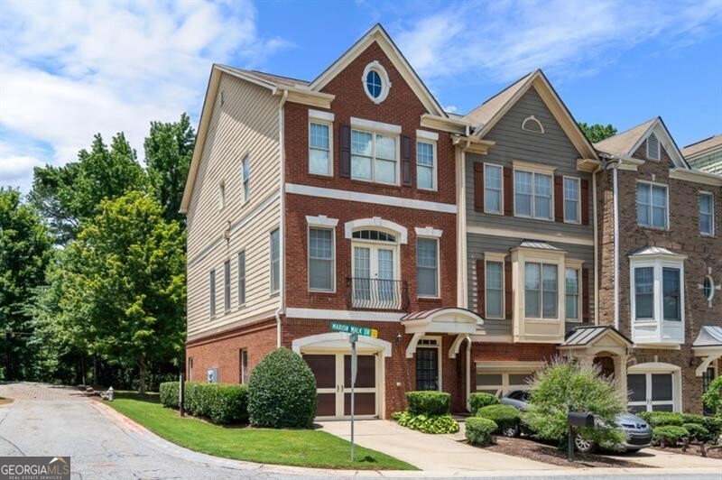 This stylish and spacious end unit is a true gem, brimming with natural light and thoughtful details throughout. Enjoy gleaming hardwood floors and a double-sided fireplace that adds warmth and charm to both the elegant dining room with its tray ceiling and the inviting family room with crown molding and recessed lighting. The gourmet eat-in kitchen shines with stained cabinetry, granite countertops, stainless steel appliances, and a central island that opens to a private deck perfect for morning coffee or evening gatherings. Upstairs, retreat to the serene primary suite featuring a walk-in closet and a spa-inspired bath with a separate shower. The terrace level offers a full bath and flexible living space ideal for a guest suite, home office, or media room. Low HOA fees cover lawn care, water, trash, and more offering comfort, convenience, and unbeatable value. First month - $800 credit