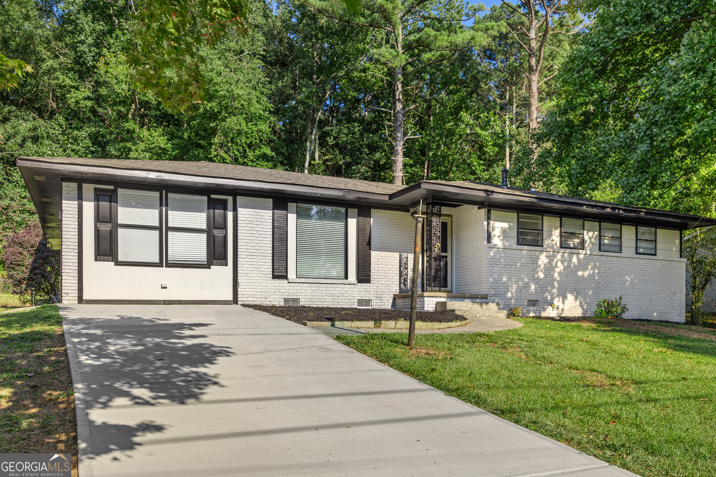 Step into this beautifully renovated 4-bedroom, 2-bathroom home located in the heart of a family-friendly Forest Park neighborhood. From top to bottom, this property has been refreshed with modern updates and thoughtful design, making it an incredible opportunity for both investors and savvy homebuyers alike. Inside, you'll find brand-new flooring throughout, fresh interior and exterior paint, and updated light fixtures that bring a bright, welcoming feel to every room. The kitchen has been completely transformed, featuring freshly painted cabinets, quartz countertops, new appliances, and a custom island perfect for meal prep or entertaining.Both bathrooms have been fully remodeled with stylish finishes, and the primary suite now includes a second closet for added convenience. This spacious home also offers two additional living areas-one that can be used as a bedroom, office space, or family room-plus a sunroom that's perfect for relaxing. Additional updates includes a new driveway with ample space for several cars. For your peace of mind, the hot water heater, HVAC system, and roof are all only a few years old, ensuring longevity and comfort for years to come. Outdoors, the generous backyard with a storage shed offers endless possibilities for gardening, play, or entertaining. All this, just under 20 minutes to Hartsfield-Jackson International Airport and close to local parks, shopping, and dining. Whether you're searching for your next investment, rental property, or a forever home, this move-in ready gem is a must-see! ***Some images have been virtually staged to better showcase the true potential of rooms and spaces in the home.
