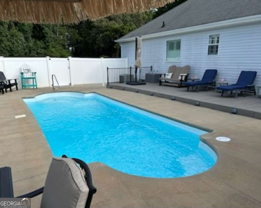 Pool Pool Pool you can't miss this one. This home is immaculate and is ready for you to call it your own. Charming 3-Bedroom, 2-Bath Experience peaceful country living with modern updates in this beautifully maintained 3-bedroom, 2-bathroom home situated on a spacious lot. With over 2k square feet of living space, this home combines comfort, convenience, and style. Inside, the open layout features a newly updated kitchen equipped with granite countertops, stainless steel appliances. The master suite serves as a private retreat, complete with a walk-in closet, a soaking tub, a separate shower, and a double vanity. For added comfort, new ceiling fans with remote controls have been installed in many rooms. Additional highlights include: THE SUNROOM !! A new HVAC system (installed in 2023) - A new back deck ideal for outdoor entertaining - A partially fenced-in backyard, perfect for children or pets. Whether you're seeking serene living with room to grow or a move-in-ready home with modern finishes, this property will meet and exceed all your needs.