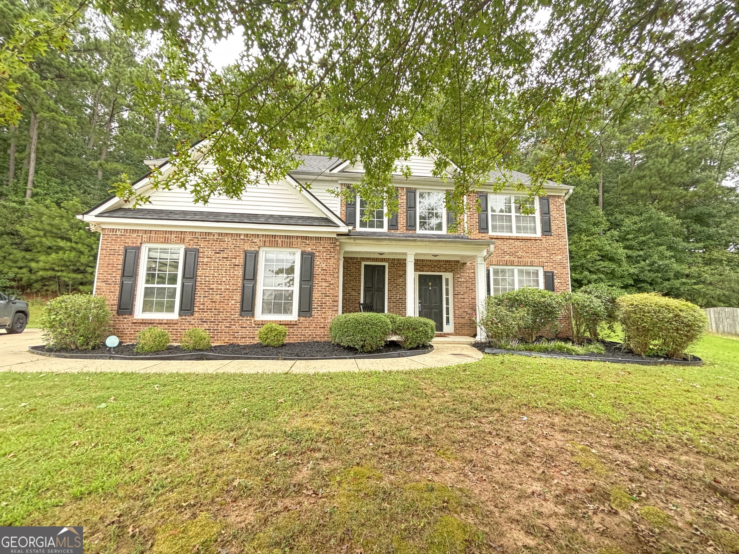 This beautiful traditional home with a charming rocking chair front porch has 4 bedrooms, 2.5 bathrooms and 2400 square feet of living space. The bright two story foyer leads to a formal dining room, open concept kitchen, fireside living room and sunroom. The light filled sunroom can be used as a den, office, playroom, library or as a great place to get cozy and relax by the fireplace in the colder seasons. The living room opens up to a spacious kitchen with granite on the countertops and island and stainless steel appliances! Upstairs you'll find an oversized master bedroom and a huge master bath with double sinks, a separate shower and garden tub and a great walk in closet. In addition to the master, there are 3 other spacious bedrooms with ample closet space. With second floor laundry, a two car garage and a private backyard, this gorgeous home has something for everyone! Schedule a tour today .
