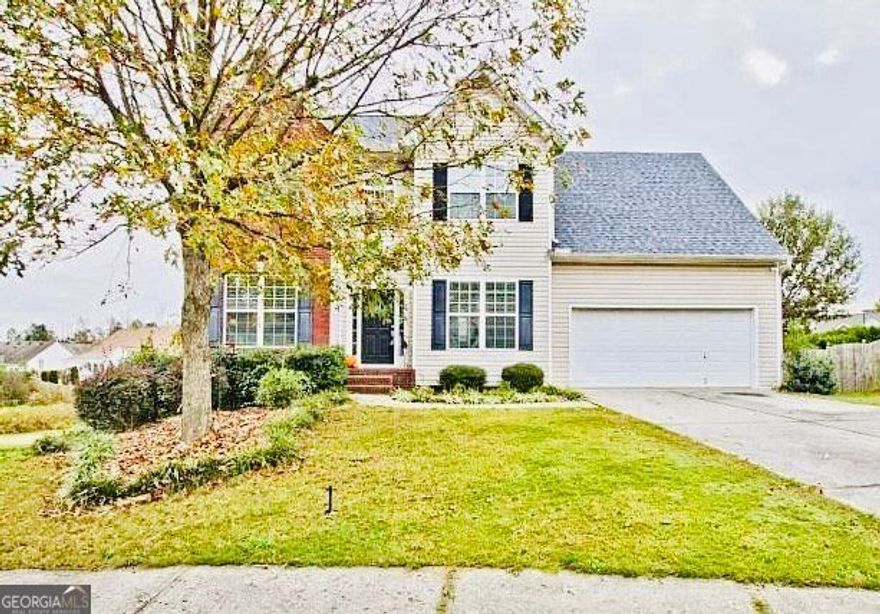 **TOP RATED SCHOOL DISTRICT** Many updates and renovations are being done currently. This charming 4-bedroom, 2.5-bathroom home located in the top of Mill Creek school district in Dacula, GA, offers a spacious area layout on a generous 0.27-acre lot. Built in 2004, it features a traditional design with a welcoming two-story foyer and a cozy gas log fireplace in the family room. The kitchen boasts white cabinets, solid surface countertops, and an eat-in area, perfect for family gatherings. Upstairs, the master suite includes a double vanity, soaking tub, and walk-in closet. The backyard is fully fenced, providing a private space for outdoor activities. Located in the Wyndsor Grove at Charleston Park community, residents enjoy amenities such as a pool, tennis courts, and playgrounds. This home offers both comfort and convenience in a desirable neighborhood.