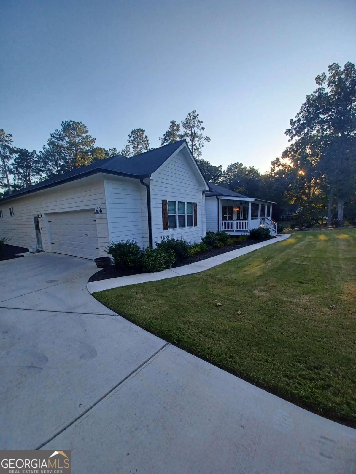 Welcome to your Farmhouse style home in beautiful Rockdale County! Gorgeous newer craftsman (2022) construction, 2,800sf, (Tax records is not correct at 2,400SF, FYI) 4-bedroom 3 bath ranch with a fully enclosed 10 feet fenced backyard for entertainment and your furry friends. Custom window treatments thru-out. Open and spacious with the kitchen as the center surrounded by an oversized great room, formal dining area, a huge island and spacious walk-in pantry. The Kitchen and island both has beautiful quartz counter tops. SS appliance package with fridge included. Private Master suite on one side of the house with a roomy bathroom containing a separate garden tub, custom tiled shower, custom dual vanities with mirrors and a huge walk-in-closet. Laundry room w/built-in cabinets, a sink and a wall-attached ironing board. 3 nice sized bedrooms on the opposite side of the home with a full bathroom with dual vanities. This home contains a side entry -- 677 square foot 2.5 car garage with storage area. Large covered front porch and covered back deck overlooking the backyard. Sodded front and back with newly planted lush landscaping. Conveniently close to everything-Make this your home today! You will not be disappointed! Agent owned. Agent is related to the seller.