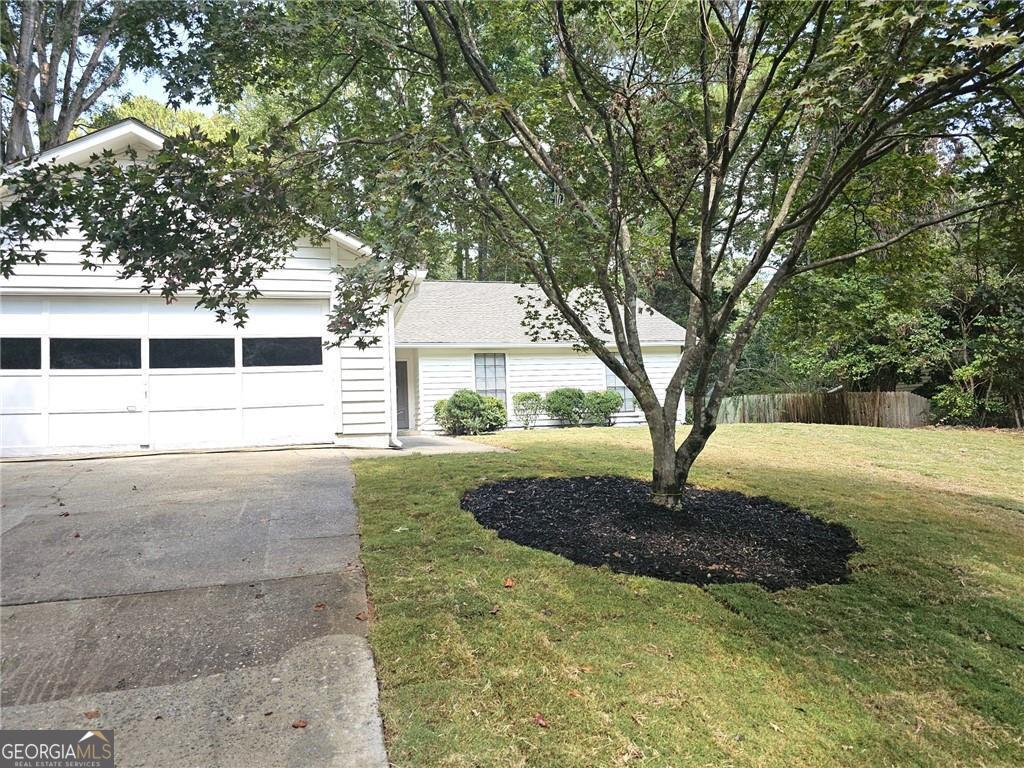 Located in a well-maintained and quiet neighborhood in Roswell, this updated single-family home offers 3 bedrooms and 2 full bathrooms. The interior features luxury vinyl flooring throughout and a centrally located fireplace that adds both warmth and character to the main living area. The kitchen has been fully modernized. Both bathrooms have been renovated with modern fixtures and finishes. The bedrooms are spacious and receive ample natural light. The layout is functional and designed for everyday living. The property is situated in a desirable area of Roswell, close to schools, parks, and local amenities. It is move-in ready and well-suited for a variety of buyers seeking a modern, low-maintenance home in a stable community.