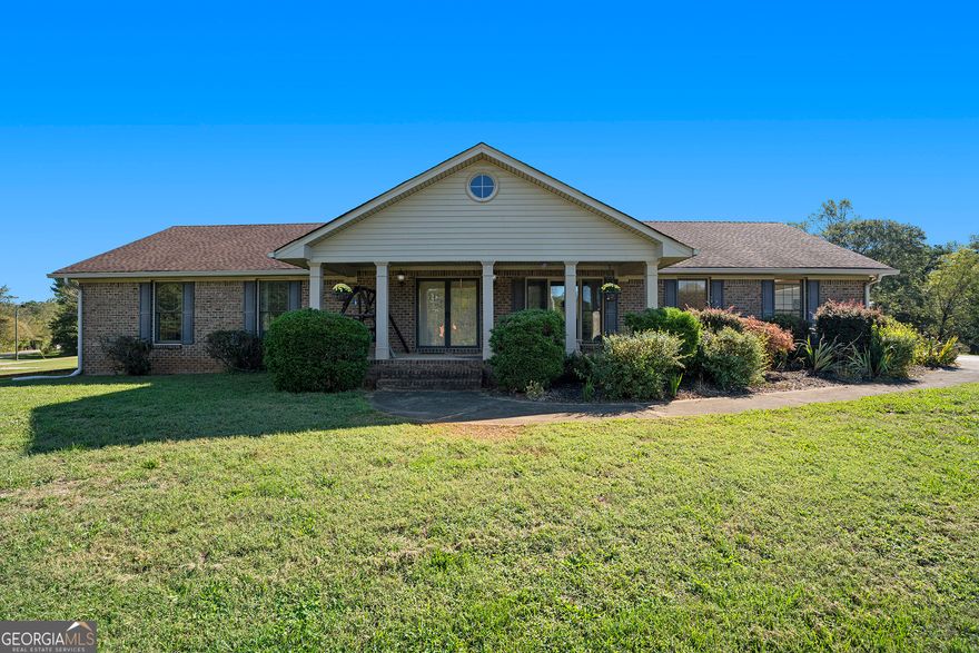 BACK ON THE MARKET! No fault of Seller. Buyer could not perform. $50K below appraised value!!  All brick RANCH on a full unfinished basement on over 2 acres!  This charming home features over two acres of cleared land on a prime corner at E. Cherokee and Tripp Rd. From the covered front porch, step inside to find a well-maintained home. The living room, full of natural light, features a stone fireplace and tray ceiling.  The welcoming kitchen is off the living room, featuring wood cabinetry, granite countertops, stainless steel appliances, and an eat-in dining area. In the kitchen is the convenient main-level laundry room.  Step into the dining room, which seamlessly flows into the all-season sunroom. Enjoy year-round comfort as you take in the view of the spacious backyard. A section of the backyard off the house is fenced. The full, unfinished basement features a convenient boat door and endless potential for more living space, including space for a second driveway. Outside, a spacious 34'x34' detached garage provides plenty of room for your toys, tools, or workshop. Located in the River Ridge High School District. This home is the ideal blend of peaceful rural living with easy access to shopping and restaurants. The lot is zoned AG.