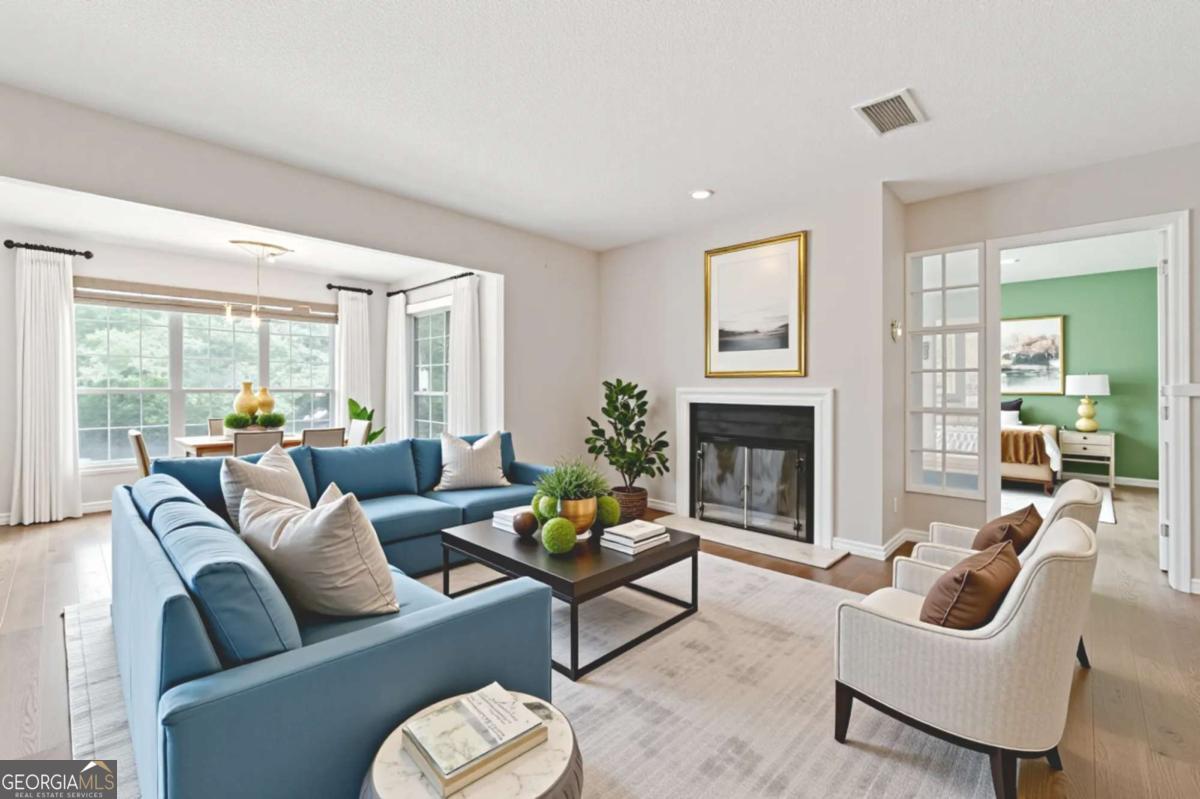 Spacious 2 bed, 2 bath corner unit condo in the heart of Smyrna. This one-level, second-floor unit offers comfortable living space. The floorplan features a separate dining area, a living room with fireplace, and an attached sunroom area-perfect for relaxing or entertaining. Enjoy a covered deck, front stoop, and an easy-to-maintain layout with plenty of natural light. The appliance package stays with the unit for added convenience. Located in a swim and tennis community with lovely ponds and walking trails. Pet-friendly and just minutes from Burger Dog Park, shopping, dining, and entertainment. Convenient access to I-285 and I-75 for a quick 20-minute commute to Buckhead and Downtown Atlanta, and only 30 minutes to Hartsfield-Jackson Airport. Close to Braves Ball Park, Cumberland Mall, and Vinings. Smyrna offers parks, a local library, recreation centers, and a vibrant dining scene. Priced below market for a quick sale, this unit is a great opportunity for buyers looking to add their personal touch. Condo values in the complex reach up to $235K-make quick updates to the baths, kitchen, lighting, and flooring for under $10K and enjoy instant equity. Perfect location for the upcoming 2026 FIFA events in Atlanta. Don't miss out on this incredible value in a sought-after community!