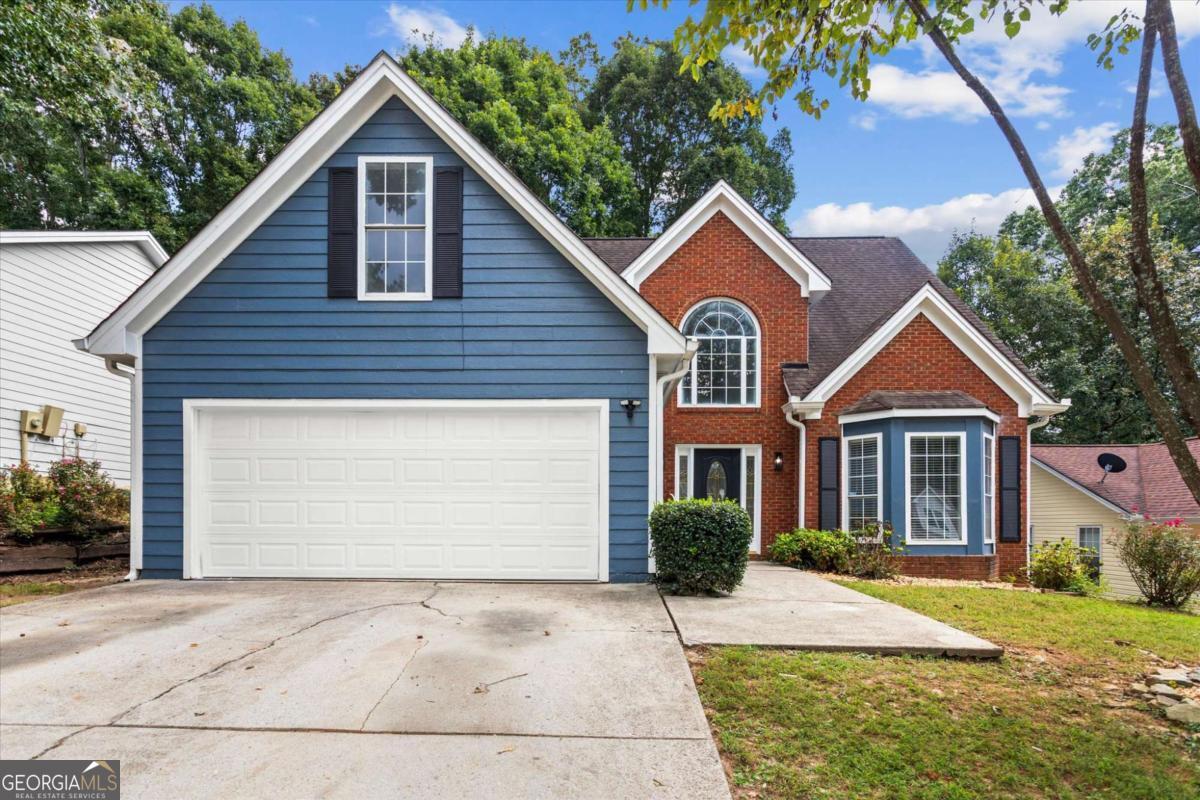 Welcome to this beautifully updated and well-maintained 4 bedroom, 2.5 bath home in the heart of Norcross, GA! The main level features a spacious master suite with a luxurious master bath, offering the perfect private retreat. The open living room boasts soaring ceilings and a gorgeous upstairs catwalk overlooking the space, adding both charm and character. An updated kitchen flows seamlessly into the living areas, ideal for entertaining or cozy family nights. Upstairs, you'll find three additional bedrooms, each spacious and full of natural light. Step outside to a private, fenced backyard-perfect for pets, gatherings, or simply enjoying the outdoors. This home truly combines comfort, style, and functionality in one of Norcross's most convenient locations!