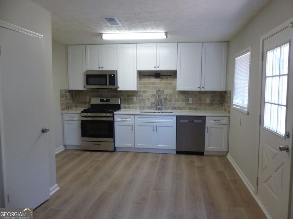 Photo of 2984 Bicentennial Drive, Stone Mountain, GA 30087 (MLS # 10661389)