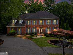 If you love the outdoors, this is the home for you! Situated on a serene half-acre wooded lot with a babbling creek, this stunning 4-sided brick traditional offers three expansive levels of completely private outdoor living-you'll feel like you're tucked away in the mountains, right in the coveted Chartwell neighborhood. Situated on one of the most private cul-de-sac lots, the home boasts a 3-car side-entry garage, a spacious family room with a 2-story stacked stone fireplace, a beautifully renovated kitchen with a large island, stainless steel appliances, generous breakfast area, and access to the covered back porch, as well as a cozy keeping room with gas log fireplace. The main level also includes a formal dining room and a flexible living room/study with a closet and full bath access-ideal for a guest room or home office. Upstairs, the enormous primary suite impresses with a tray ceiling, spa-like ensuite featuring dual vanities, whirlpool tub, large shower, and a bonus sitting room/nursery/office, plus private access to the top-floor covered porch. The upper level also offers a versatile loft area and three additional spacious bedrooms-one with a private ensuite, the other two sharing a Jack-and-Jill bath. The full daylight basement includes a third fireplace and opens to a beautiful brick patio, offering endless potential for customization. Community & Location: Chartwell residents enjoy top-notch amenities including a Clubhouse, Pool, Tennis Courts, Pickleball, Lake, and Playground, with path access to Newtown Park, which features over 2 miles of trails, the Veterans Memorial Walk, Park Place Senior Center, Burkhalter Amphitheater, and a 1-acre dog park with turf, sprinklers, and obstacle courses. Newtown Recreation offers a variety of youth sports including soccer, lacrosse, baseball, and adaptive recreation. This unbeatable location is convenient to top public & private schools, GA-400, Historic Roswell, Avalon, and the Chattahoochee River, with direct access to shopping and dining.