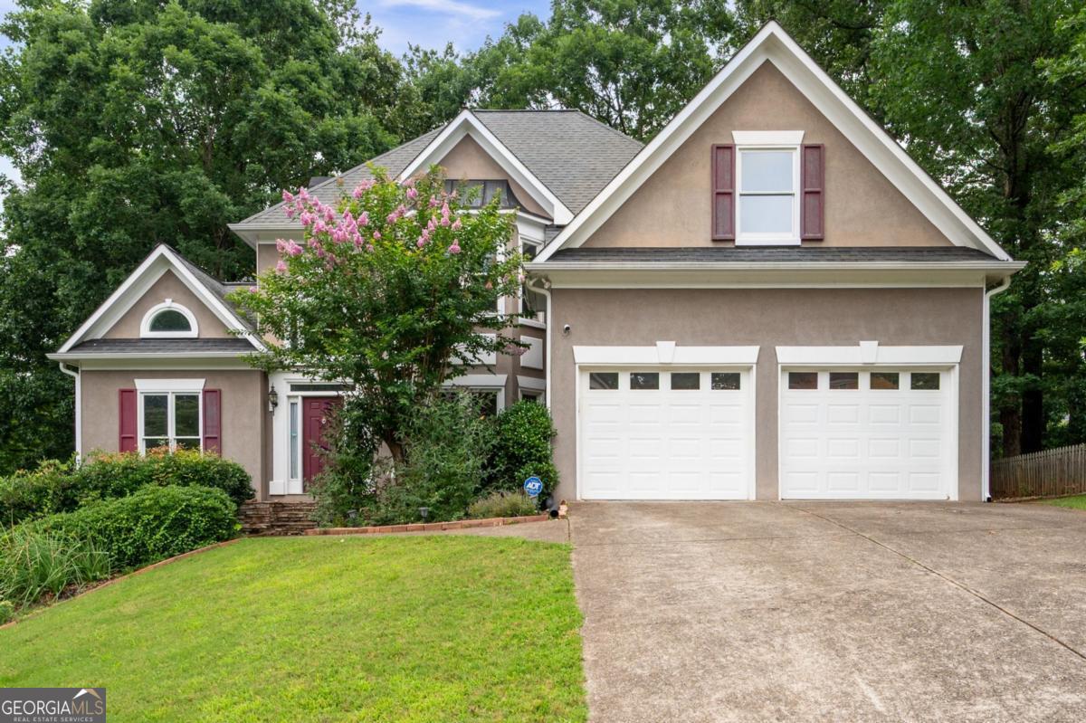 Welcome to this beautifully maintained 4-bedroom, 3.5-bath home nestled in the highly sought-after Sandy Plains community. Offering just over 3,600 square feet of sophisticated living space, this home seamlessly combines timeless charm with modern upgrades in an unbeatable location. From the moment you enter, you'll be greeted by an abundance of natural sunlight and thoughtful design throughout. The inviting front sitting room provides a perfect space for a home office or cozy den and is conveniently located across from the elegant formal dining room-ideal for hosting gatherings. The heart of the home is the expansive great room with a fireplace, open to the stunning gourmet kitchen featuring granite countertops, newer cabinetry, stainless steel appliances, an eat-in island, and a charming keeping room with its own gas log fireplace-creating a warm and welcoming space for everyday living. Upstairs you'll find all four spacious bedrooms, a well-appointed laundry room, and a recently renovated owner's suite that serves as a true retreat. The primary bathroom boasts tray ceilings, dual vanities with quartz countertops, a beautifully tiled walk-in shower, a soaking tub, and a generous walk-in closet with custom built-ins. The secondary Jack and Jill bathroom has also been updated with stylish new vanities, sleek quartz countertops, and modern fixtures-offering both functionality and flair. The powder room on the main level has been similarly upgraded, creating a cohesive, polished feel throughout the home. The fully finished daylight basement offers incredible flexibility with a large rec room, bonus room, a potential guest suite, full bathroom, and a dedicated workshop/storage area-perfect for multi-generational living, hobbies, or home gym. Step outside to a landscaped backyard complete with a deck for entertaining and a cozy fire pit area-an ideal setting for relaxing evenings under the stars. Located in a vibrant HOA community, residents enjoy access to a large Olympic-sized pool, tennis courts, playground, and a beautiful clubhouse perfect for special events and celebrations. With shopping, dining, and entertainment just minutes away-and quick access to I-75 and I-575-this home offers the perfect balance of convenience and comfort, just a short drive to both Woodstock and Roswell. Don't miss the opportunity to own this exquisite home in one of East Cobb's most desirable neighborhoods!